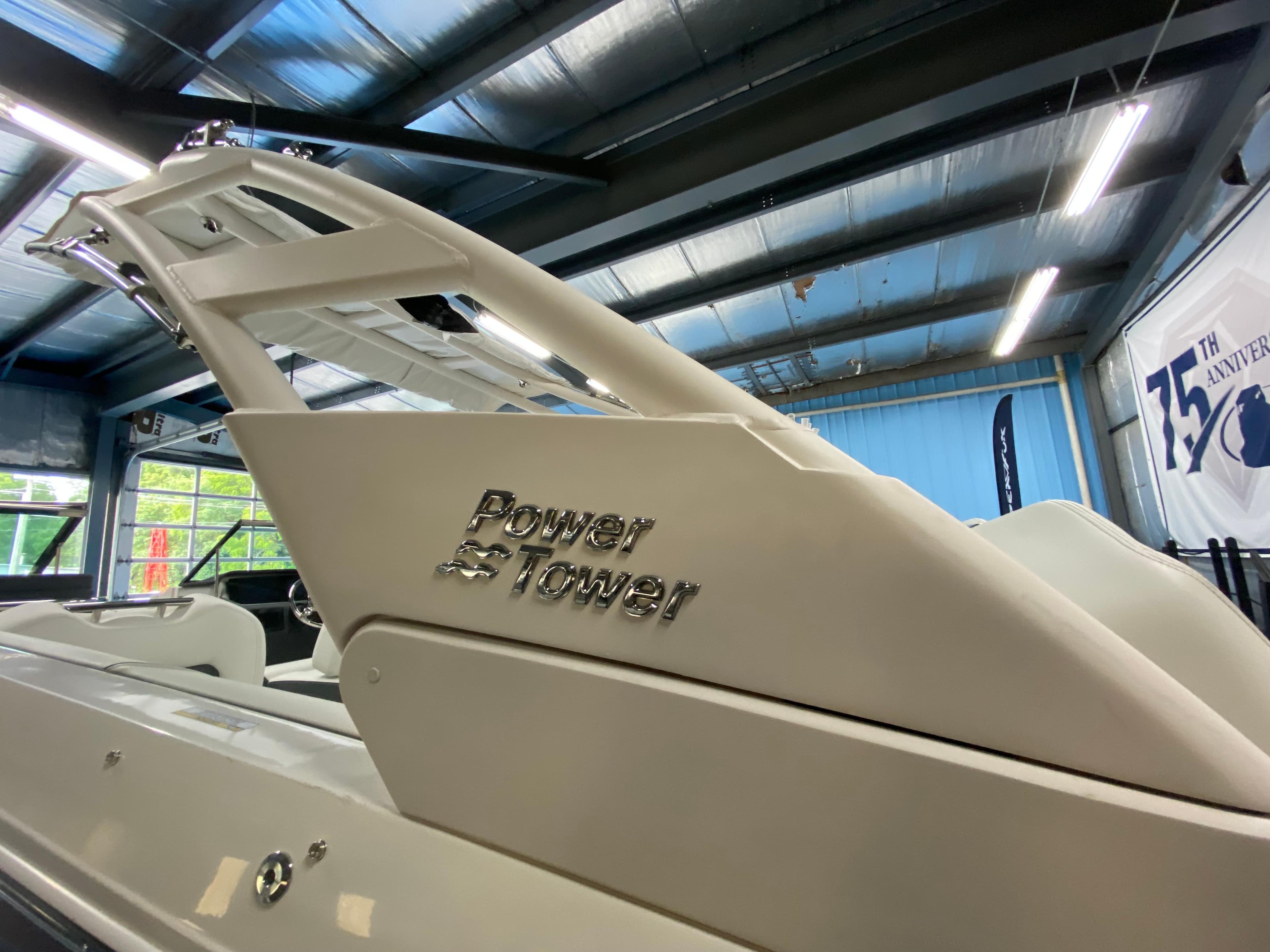 2025 Regal LX6 boat with Power Tower feature in showroom.