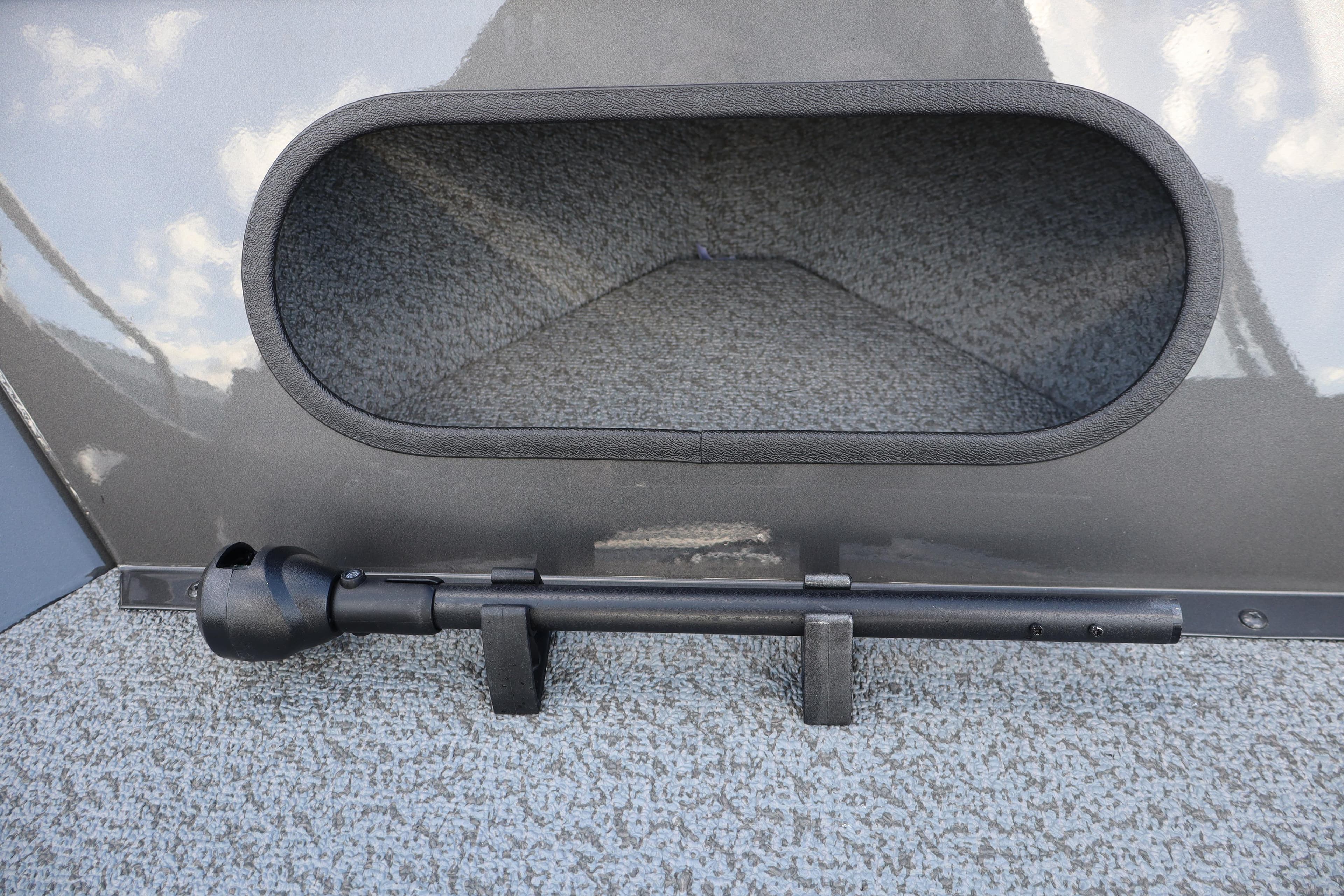 2026 Smoker Craft Pro Tracer 162 boat interior detail with rod holder and storage compartment.