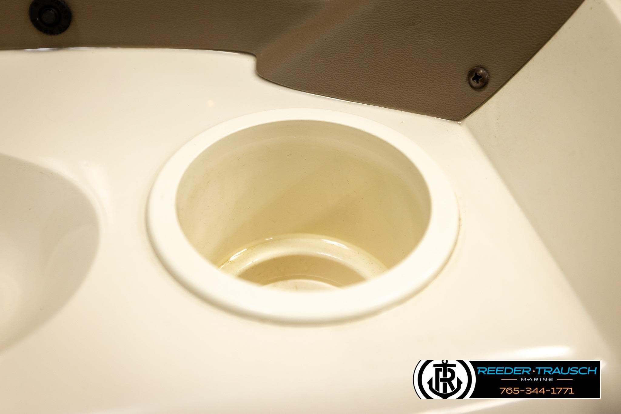 Cup holder in 2008 Sedona 20 CR boat interior, Reeder-Trausch Marine branding.