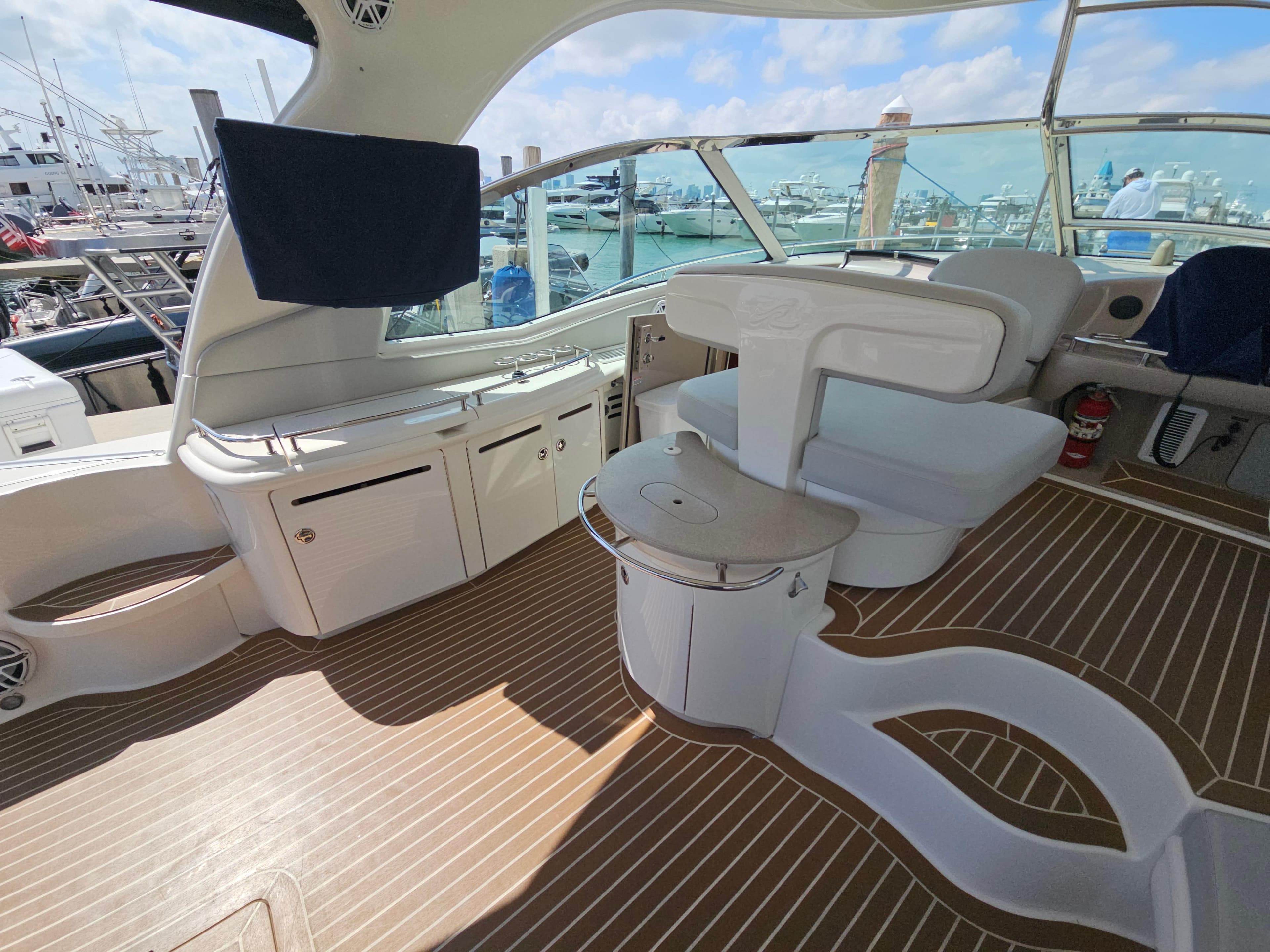 Luxurious 2005 Sea Ray 500 Sundancer yacht interior with elegant seating and wood flooring.