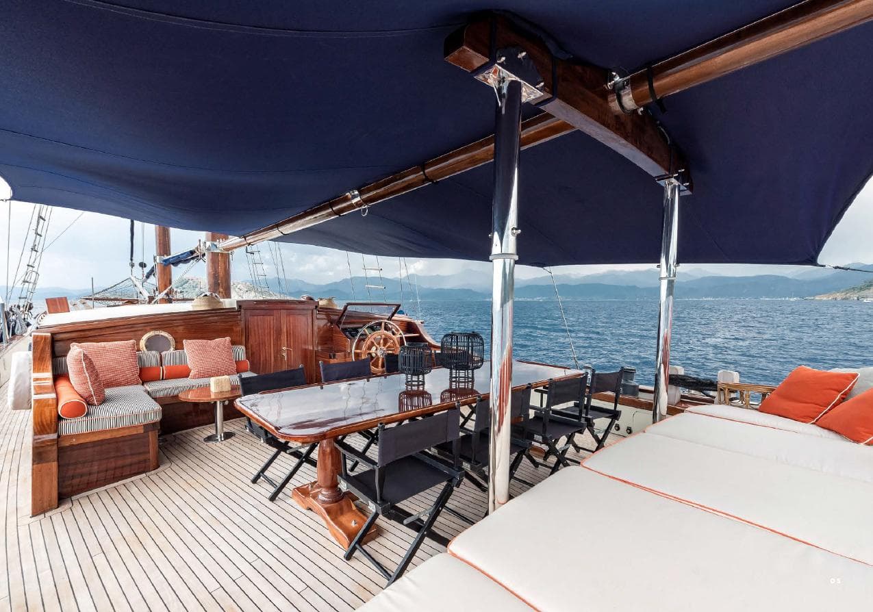 Luxurious deck of 1993 Custom Sailing Yacht Ocean Pure with elegant seating and ocean view.