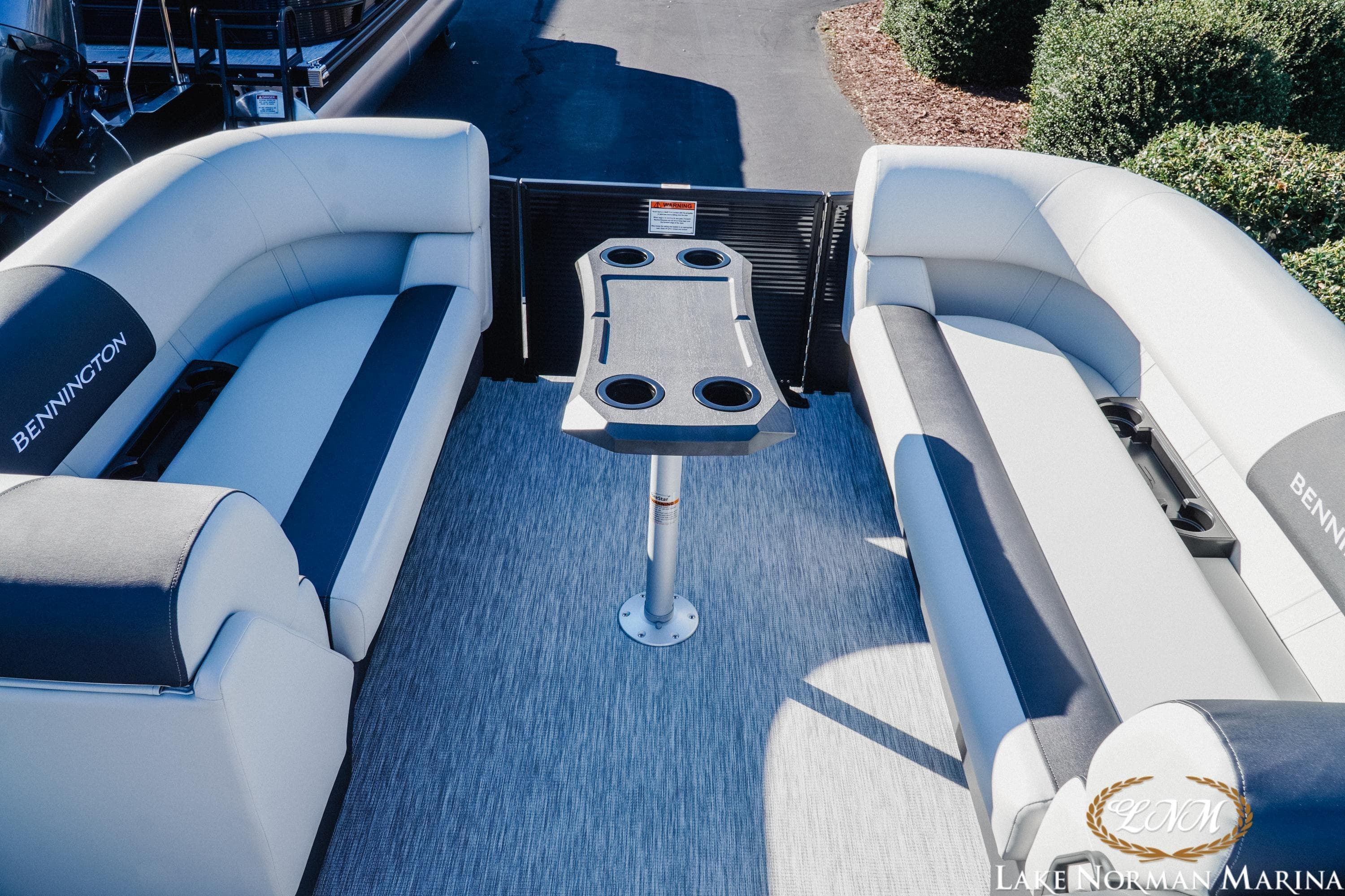2026 Bennington 22SSB SNAP pontoon boat interior with seating and table.