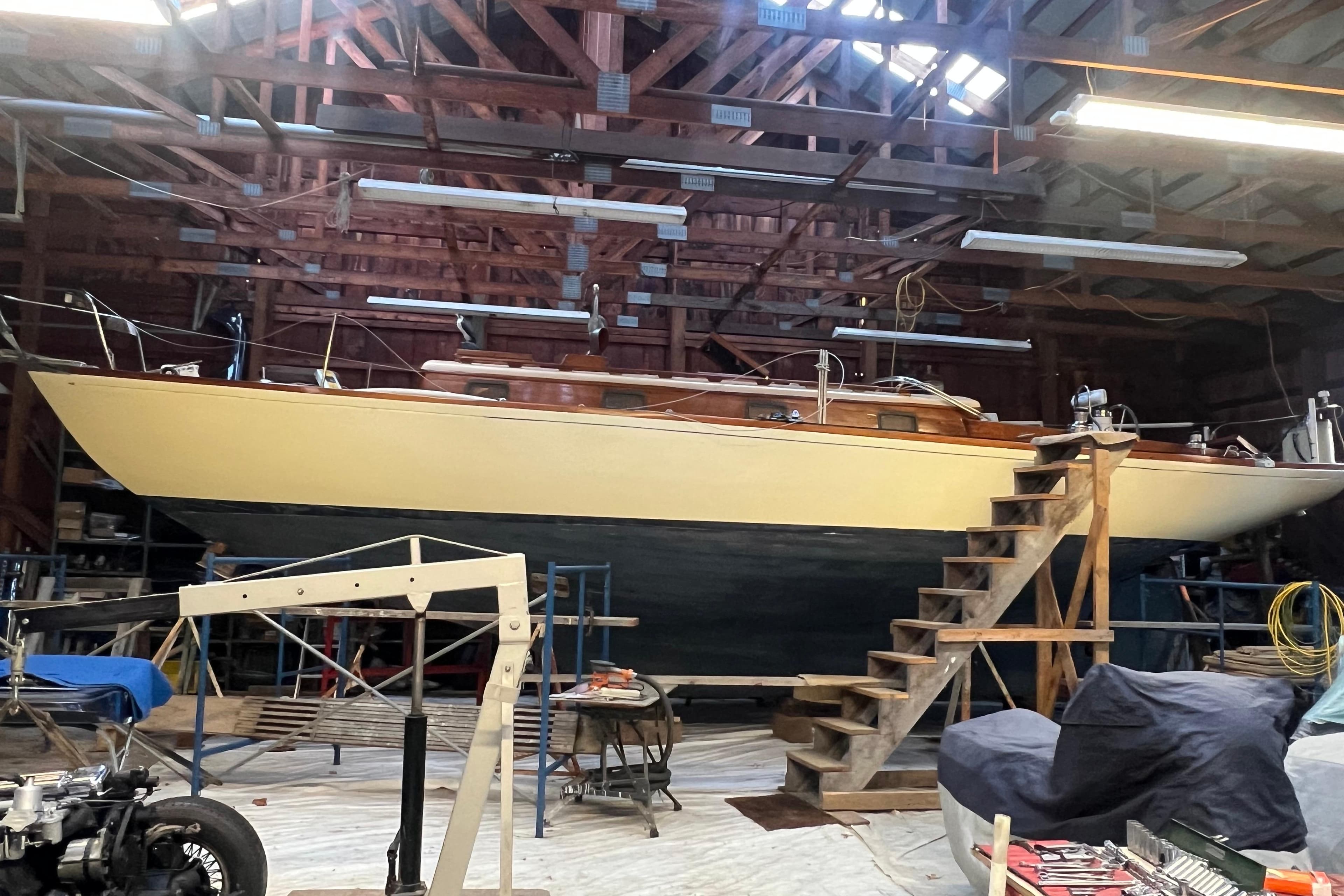 1962 Ted Hood Little Harbor 40 Yawl in a workshop, undergoing maintenance.