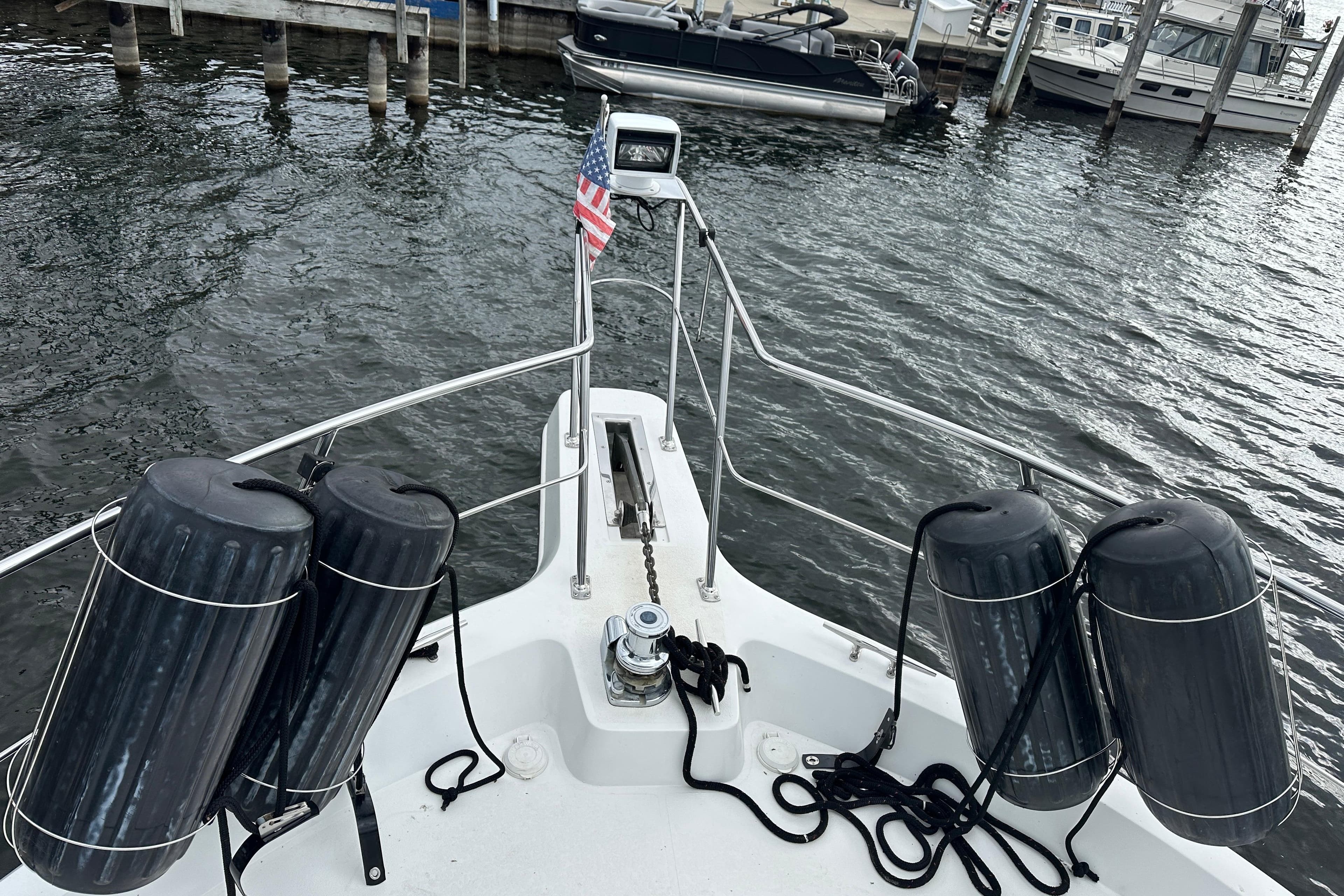 Bow view of 1998 Carver 445 Aft Cabin Motor Yacht at dock.