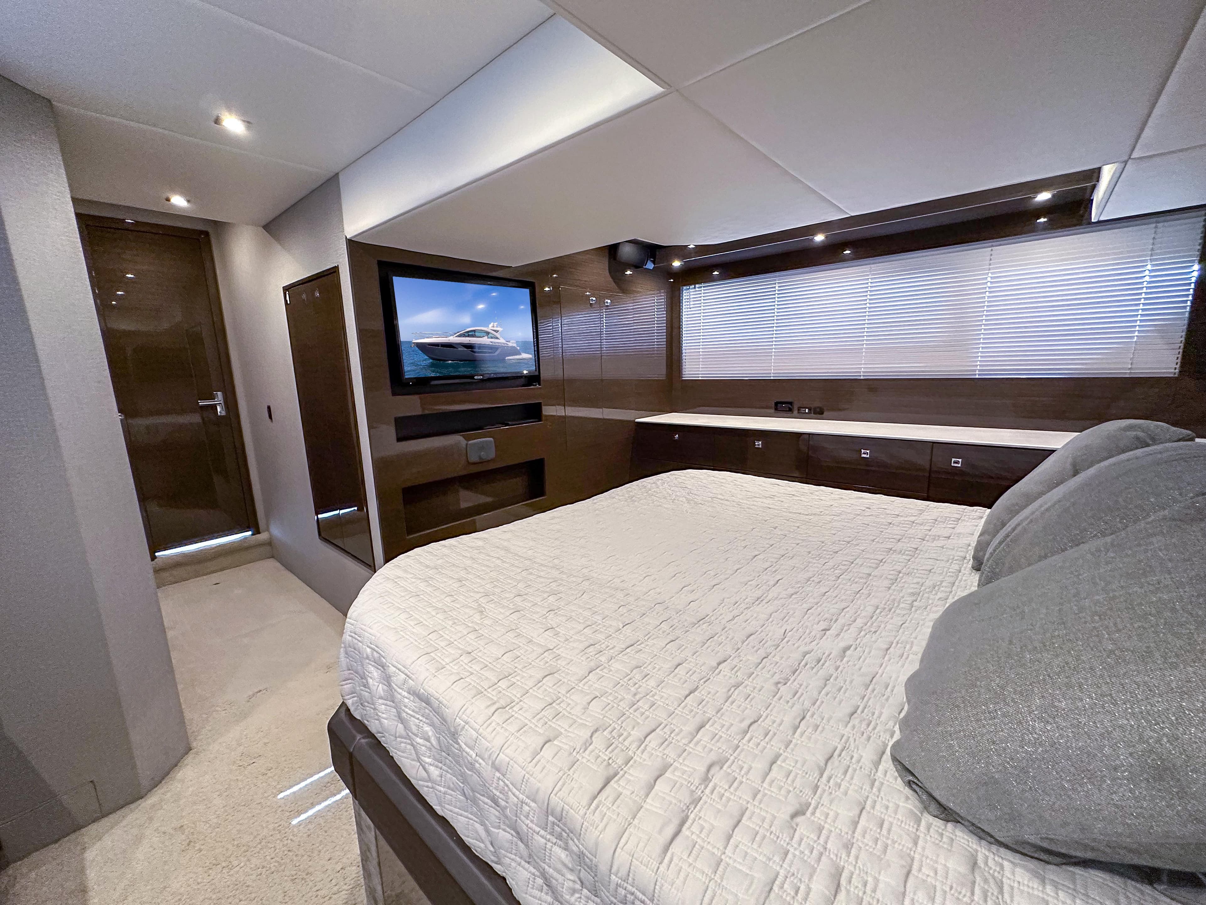 Luxurious bedroom on a 2019 Cruisers Yachts 50 Cantius.
