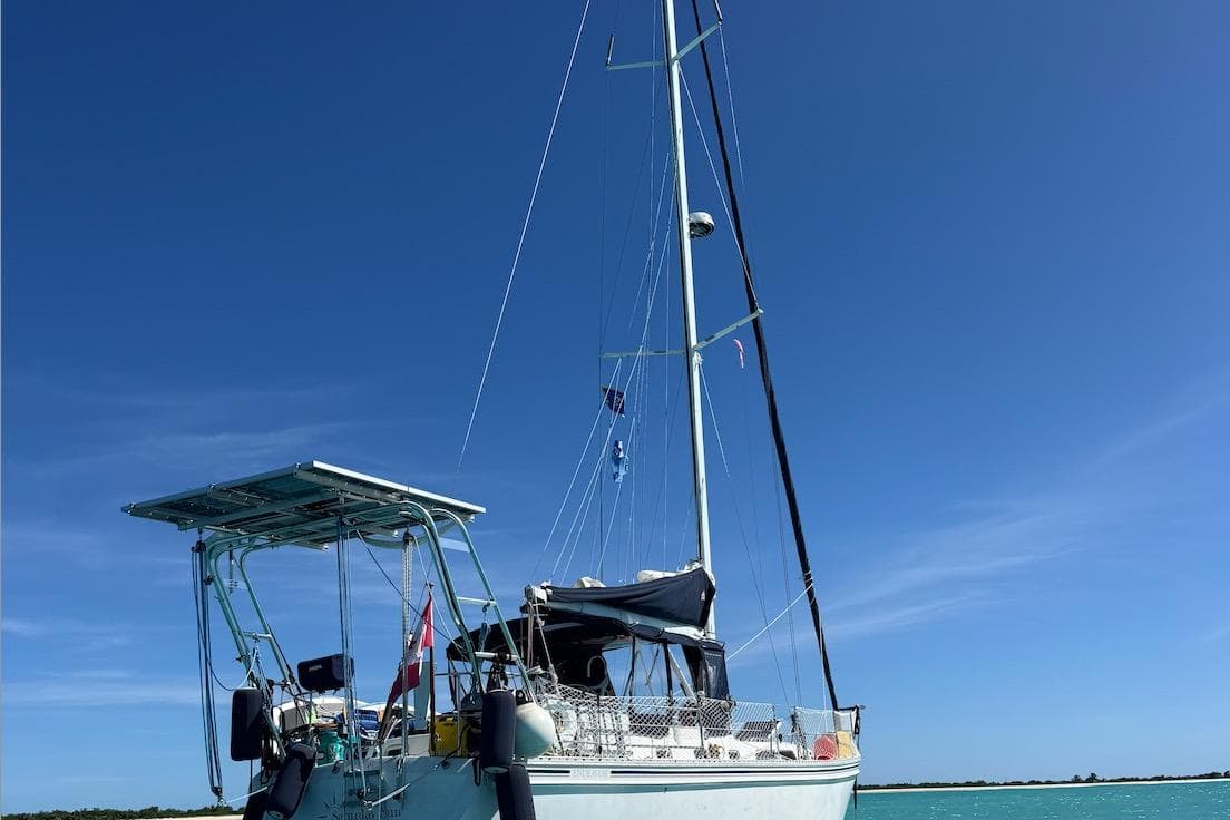 Sailboat Endeavour 42, 1991 model, anchored under clear blue sky.