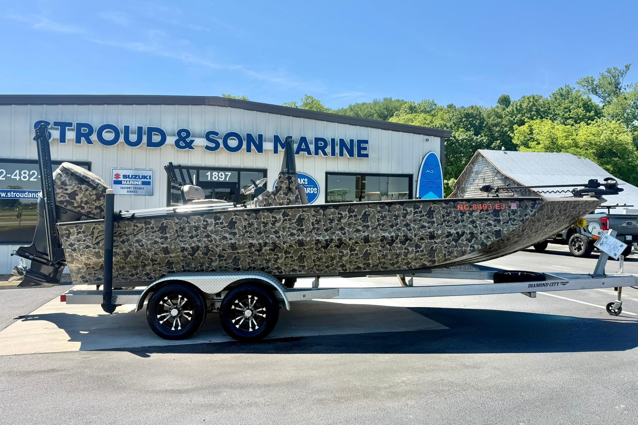 2019 Excel 230 Bay Pro boat on trailer at Stroud & Son Marine dealership.