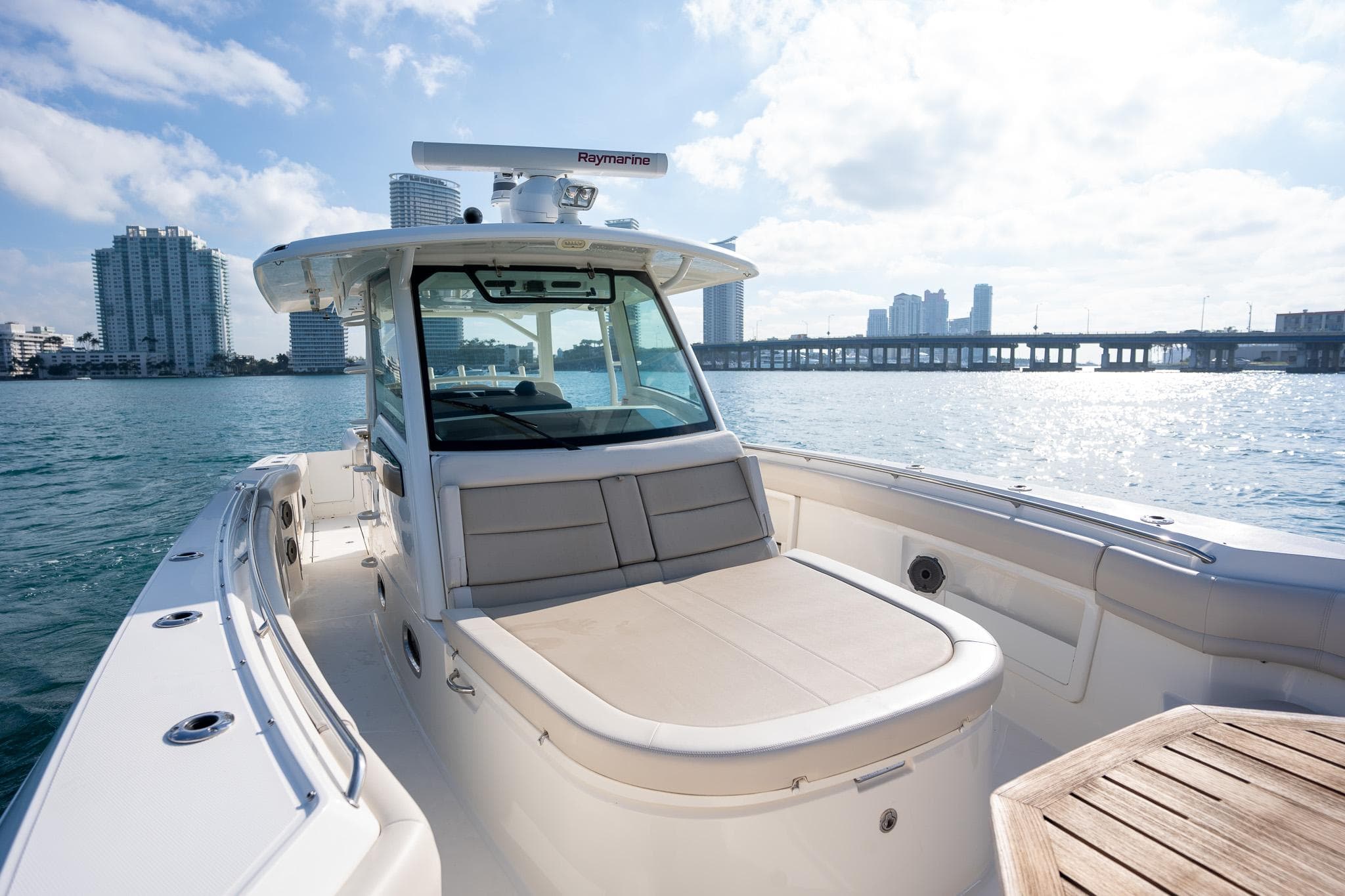 2020 Boston Whaler 380 Outrage boat on water with city skyline background.