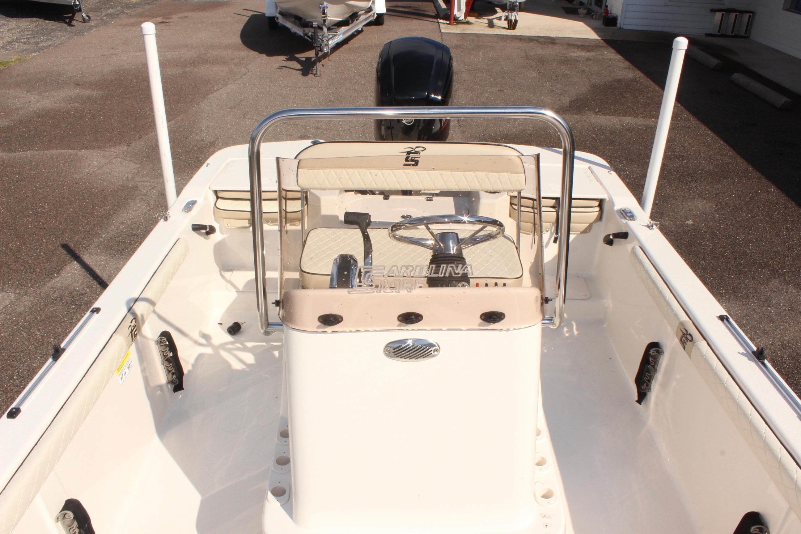 2022 Carolina Skiff 17 LS boat interior with steering console and seating.