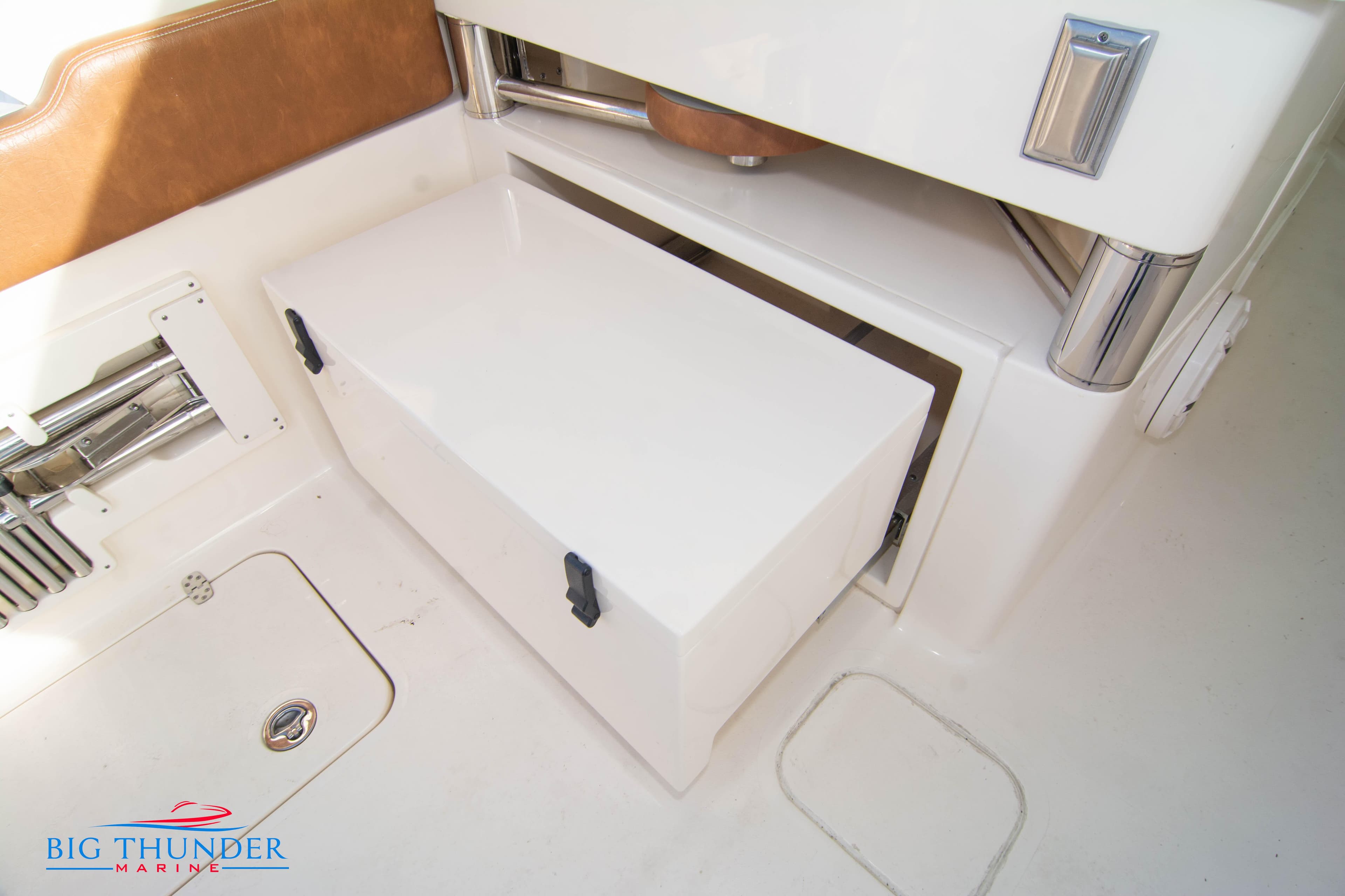 2022 Scout 350 LXZ boat interior storage compartment with white finish and brown accents.