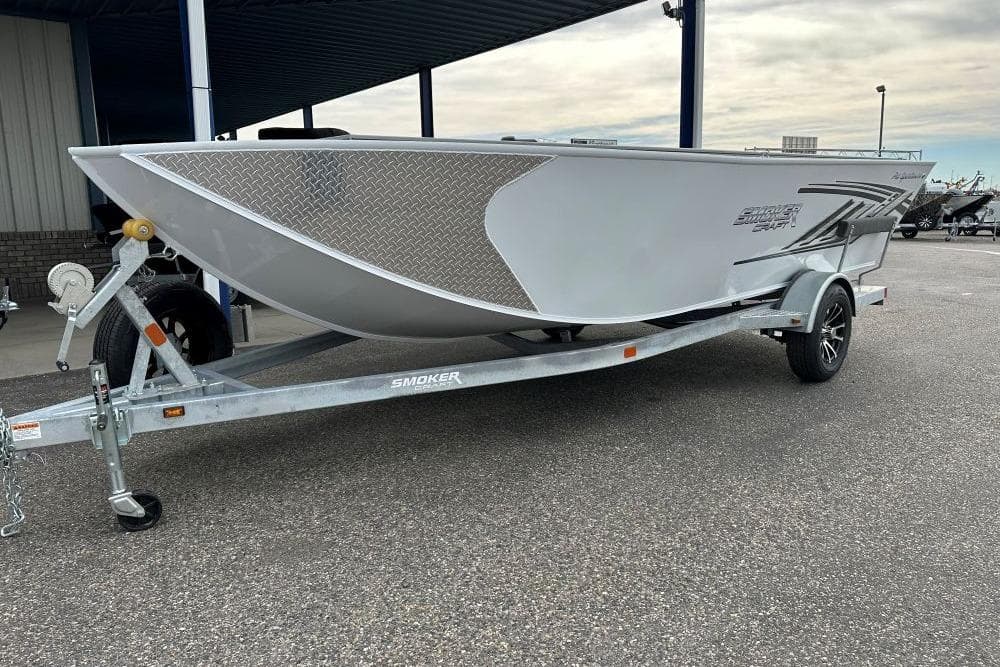 2026 Smoker Craft Pro V Sportsman 1872 CC boat on trailer, parked outdoors.