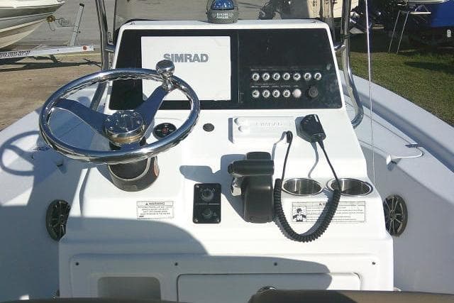 2017 Sportsman Masters 207 Bay Boat console with steering wheel and Simrad display.