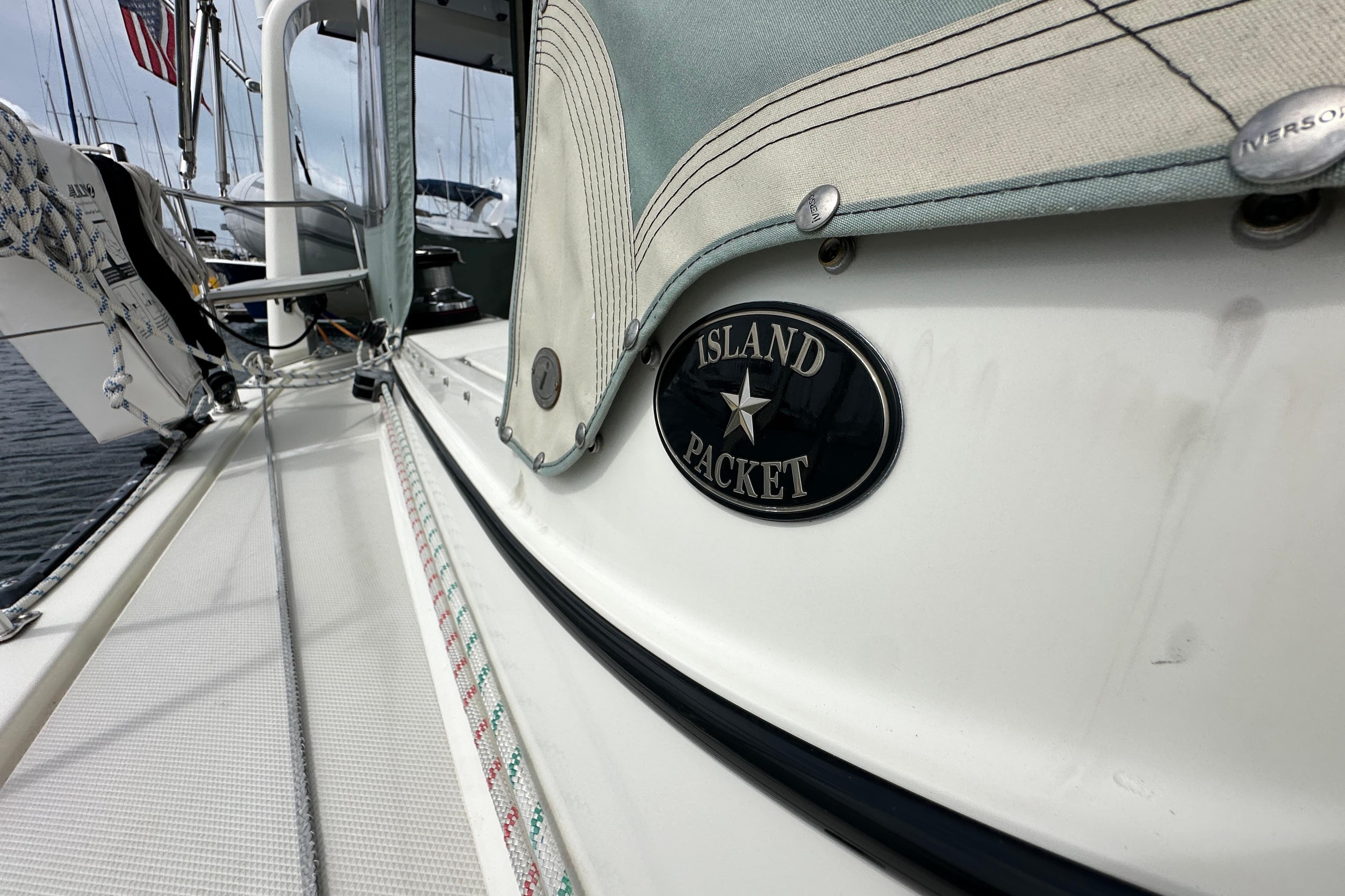 2023 Island Packet 439 sailboat deck with logo, showcasing sleek design and craftsmanship.