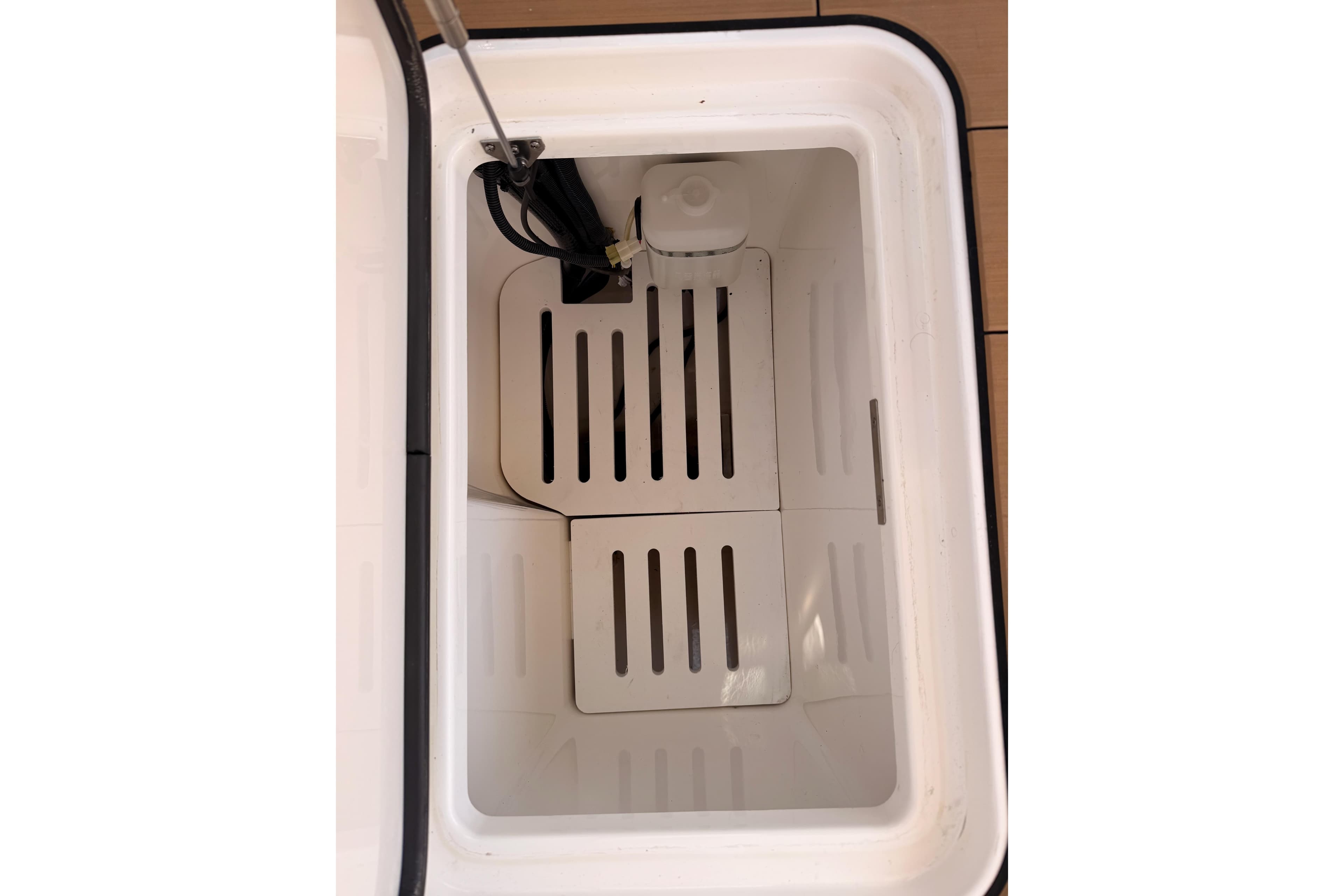 Interior view of Aviara AV32 I/O 2022 cooler compartment with slotted shelves.