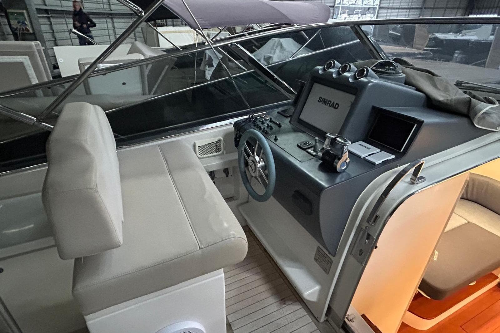Cockpit of 2019 Itama 45s yacht with steering wheel and navigation equipment.