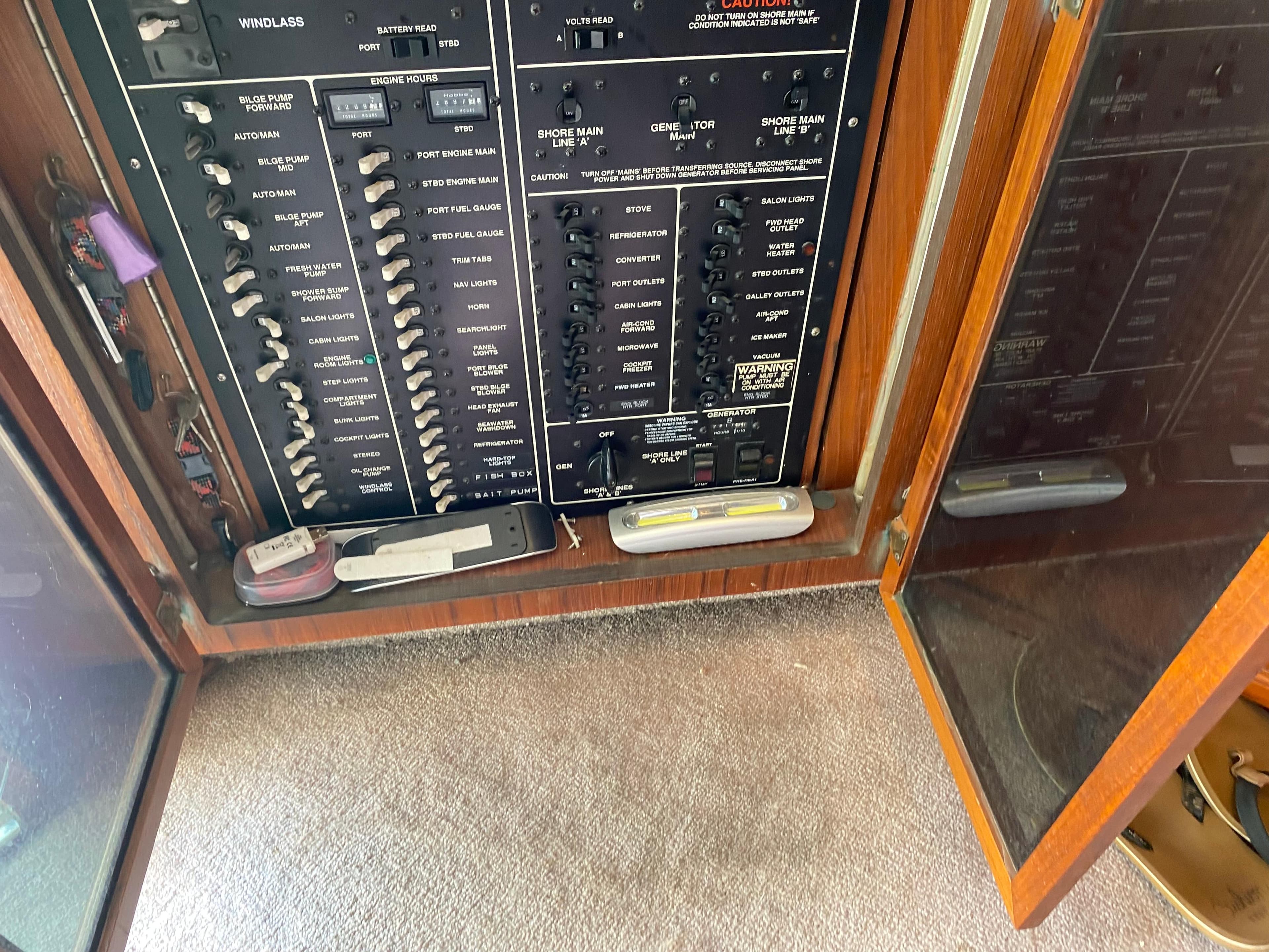 Electrical panel inside a 1990 Egg Harbor 42 Golden Egg yacht, featuring various switches and controls.