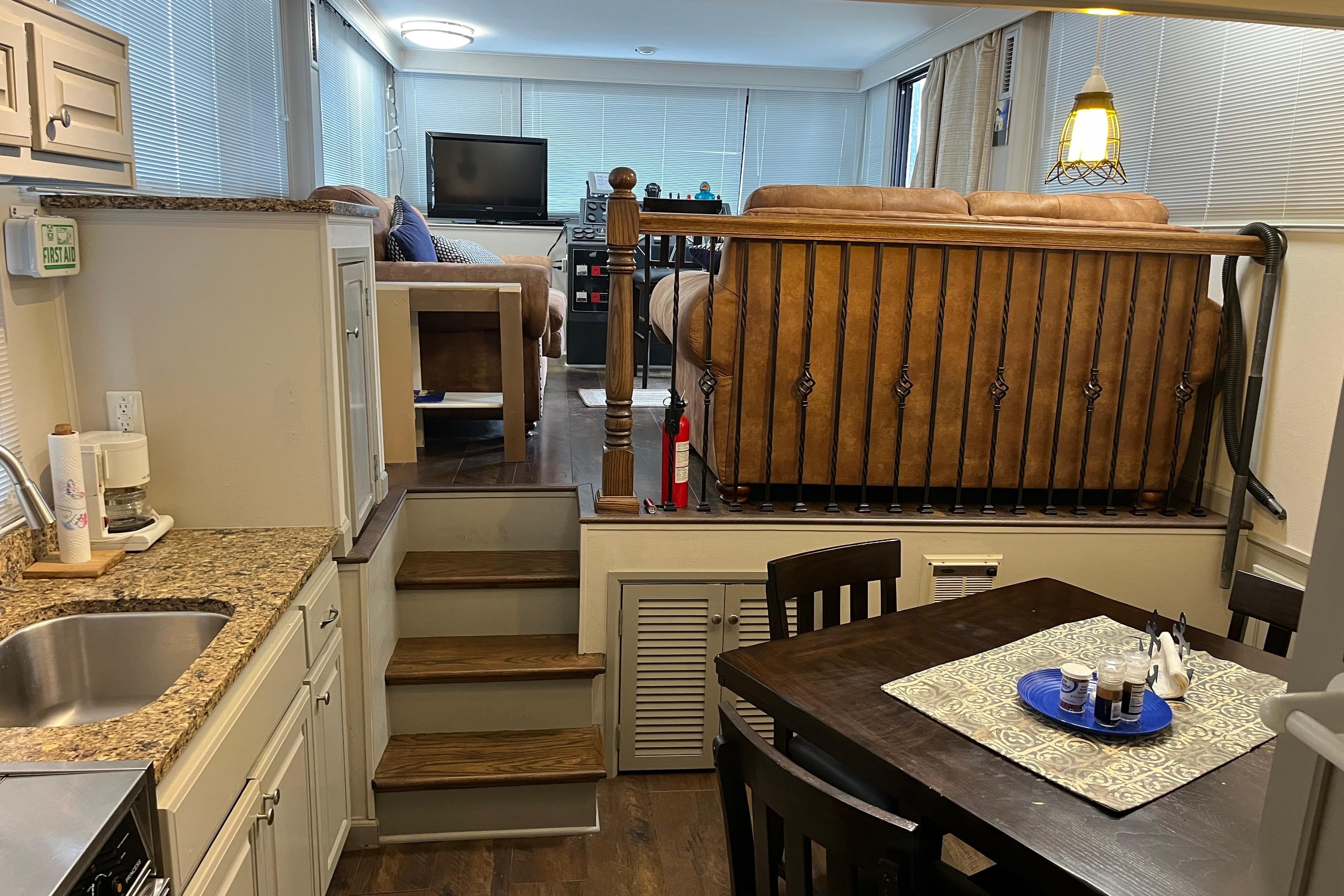 Interior of 1995 WaveLenth Wide Body RV with kitchen and living area.