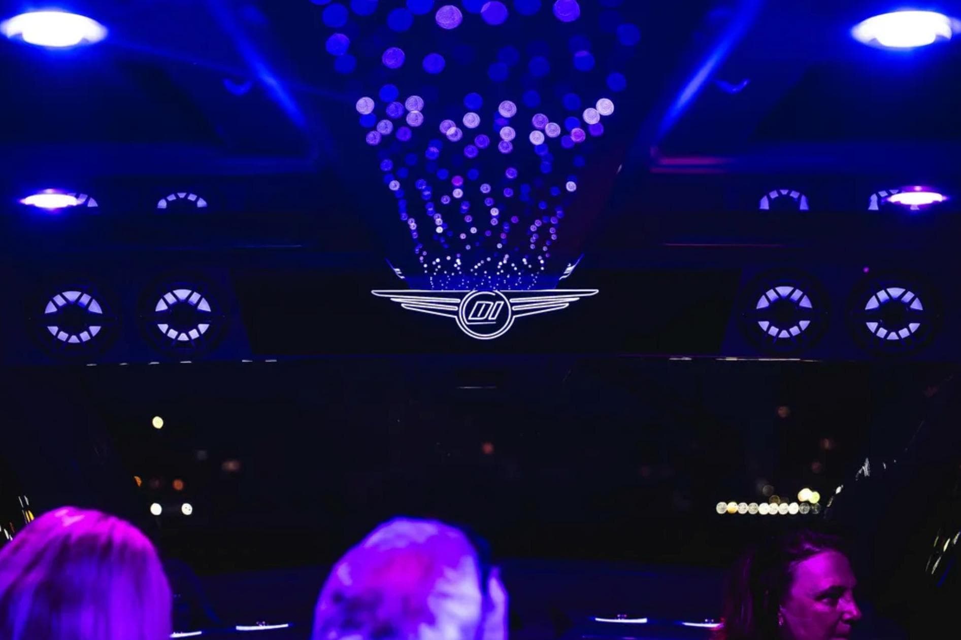 Interior of 2026 Deep Impact 499 Sport with ambient purple lighting and logo.