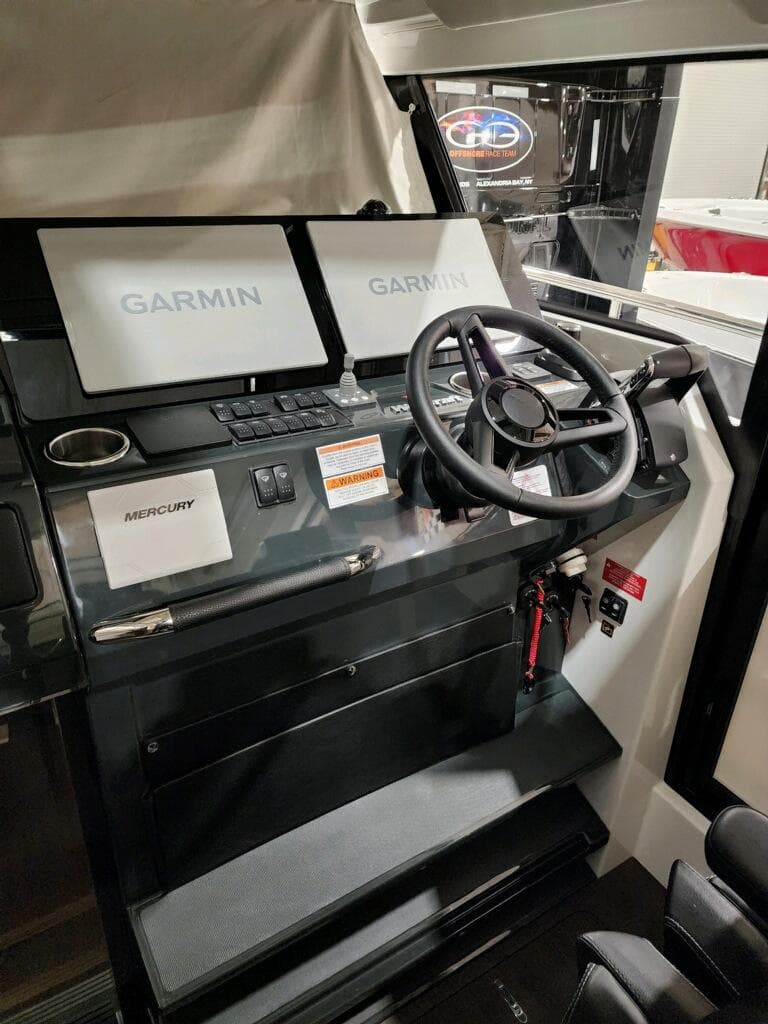 2024 Wellcraft 355 Commuter helm with Garmin navigation displays.