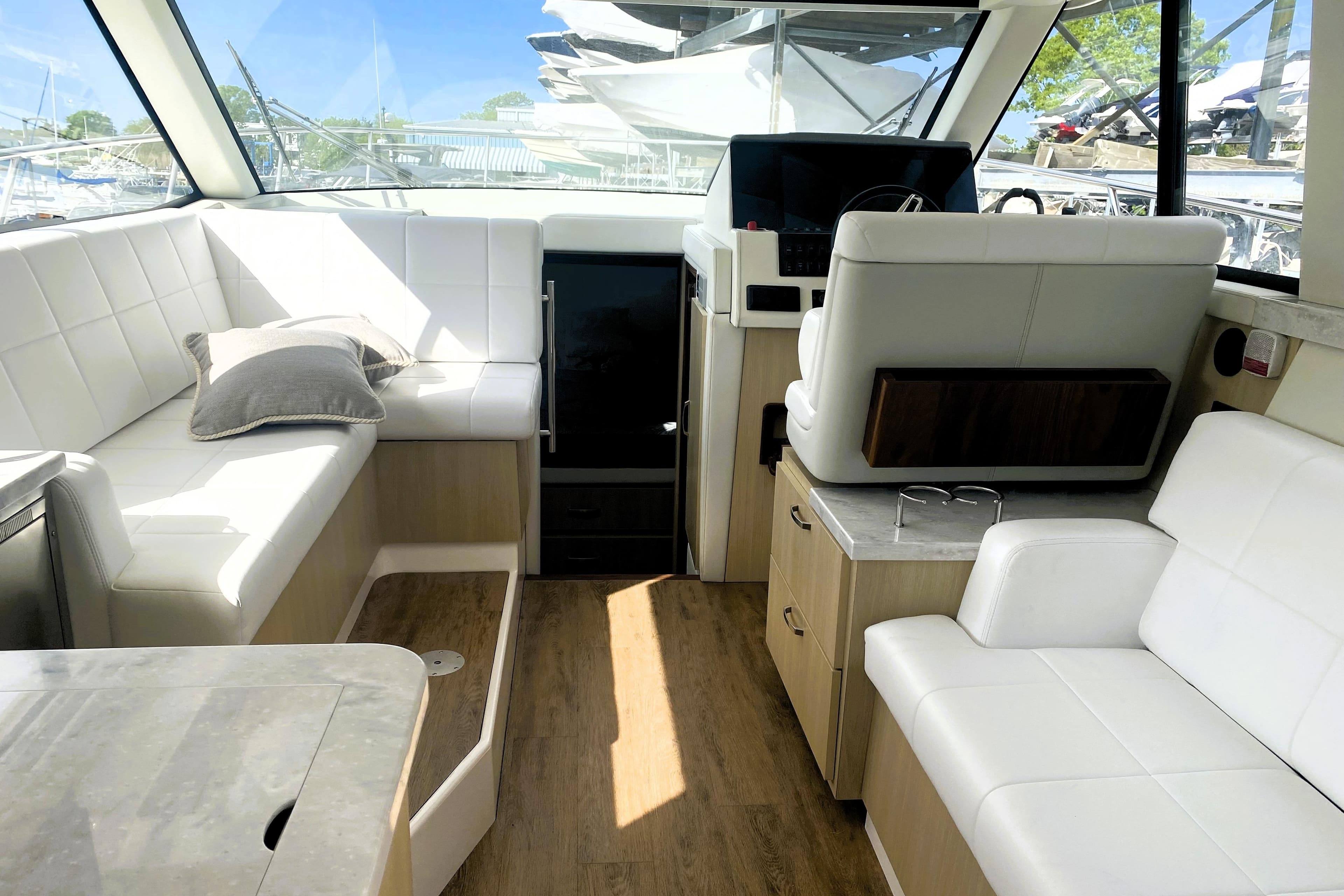 Interior of 2023 Regal 38 Grande Coupe with white seating and modern design.