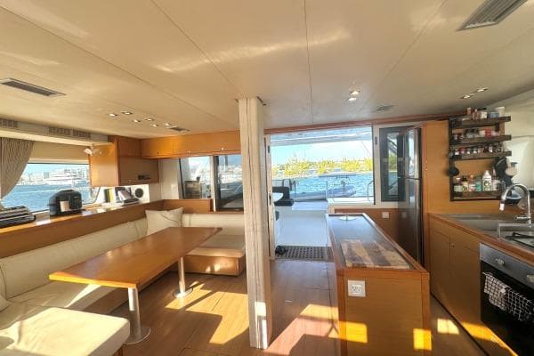 Interior of 2015 Lagoon 52 F yacht with modern kitchen and dining area.