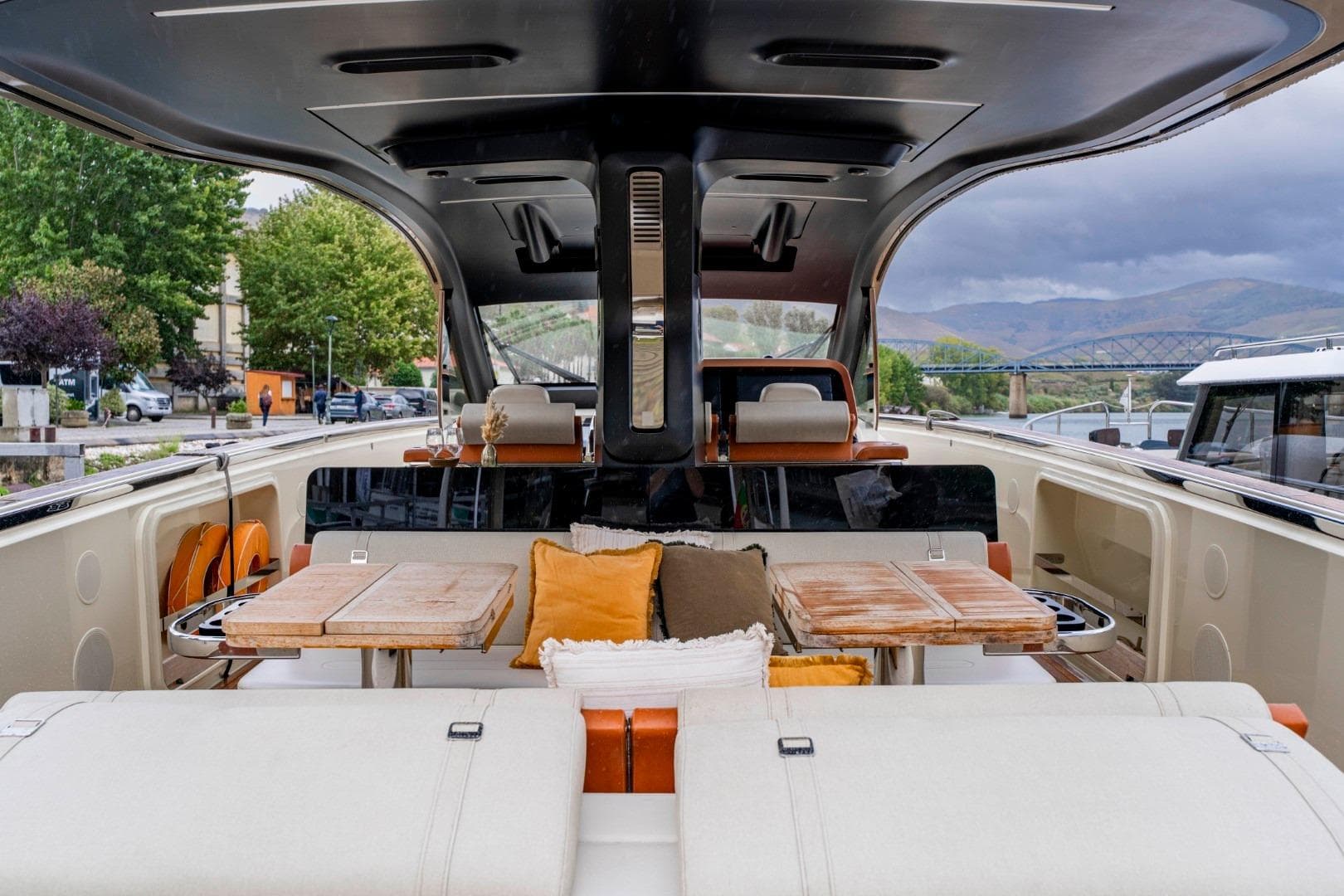 Luxurious 2022 Invictus TT460 yacht interior with elegant seating and dining area.