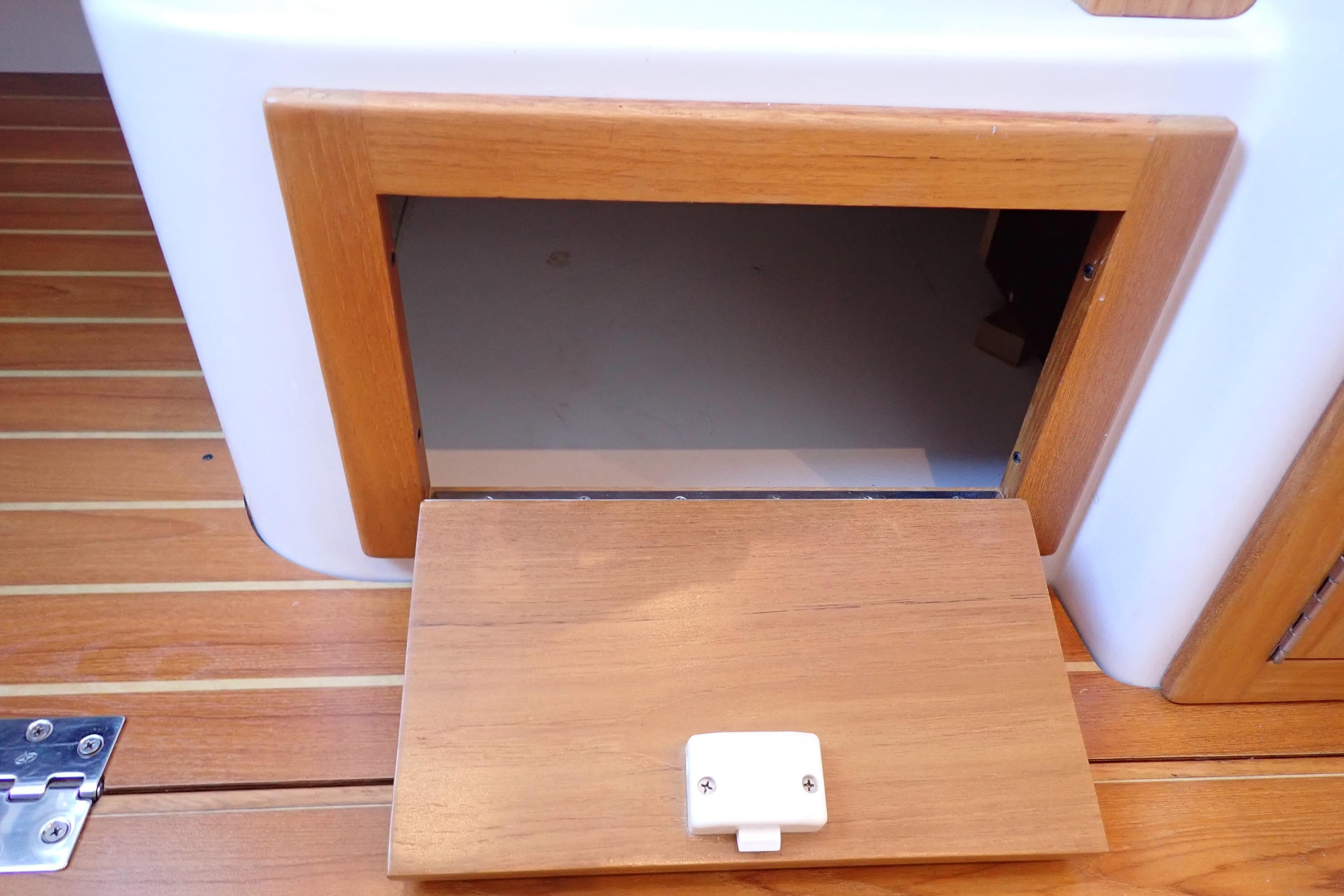 Wooden hatch on 2023 True North 34 Outboard Express boat deck.