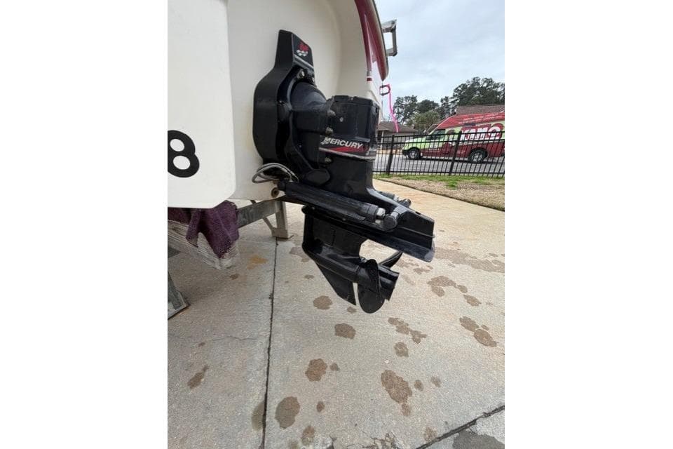 Outboard motor of 2000 Chaparral 232 Sunesta boat on a trailer.