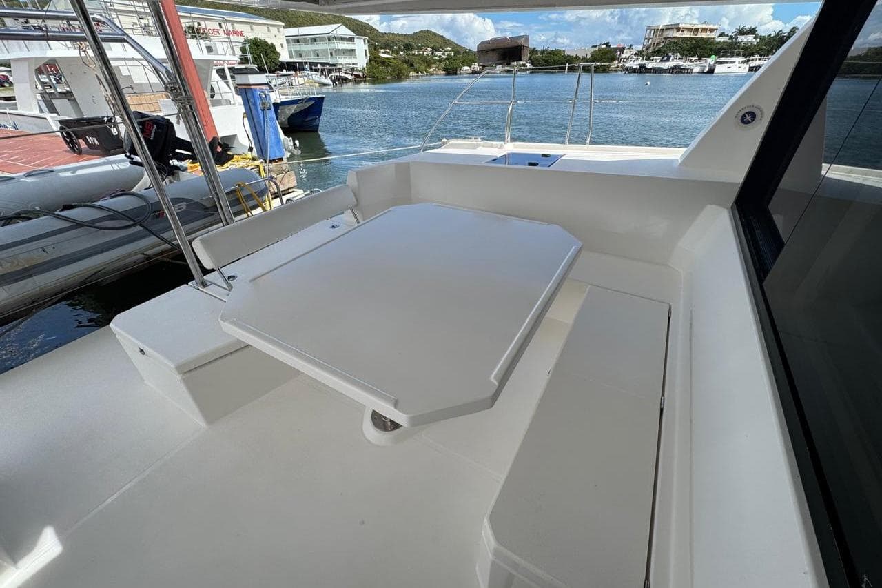 Leopard 45 catamaran deck with seating area, docked at marina, 2017 model.