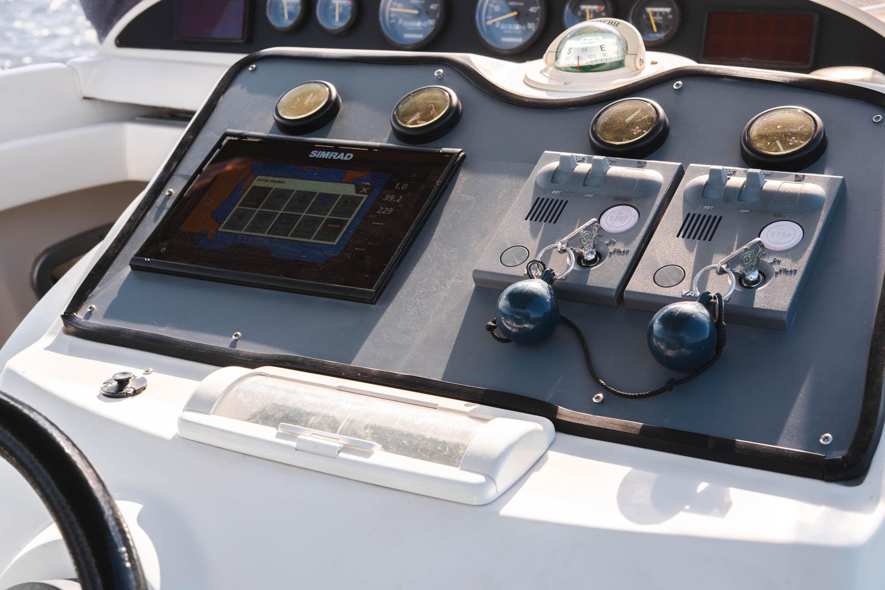 Control panel of 2007 SACS Stratos S42 boat with navigation and throttle controls.