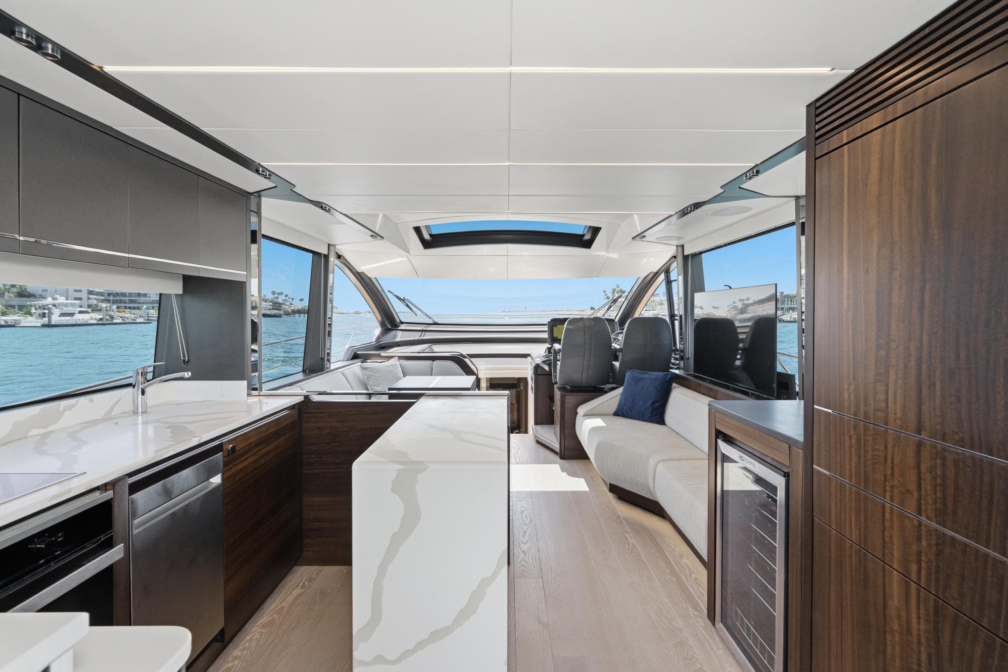Luxurious interior of 2023 Sunseeker 65 Sport Yacht with modern design and panoramic views.