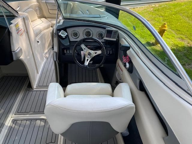 2010 Sea Ray 230 Select boat interior with steering wheel and dashboard.