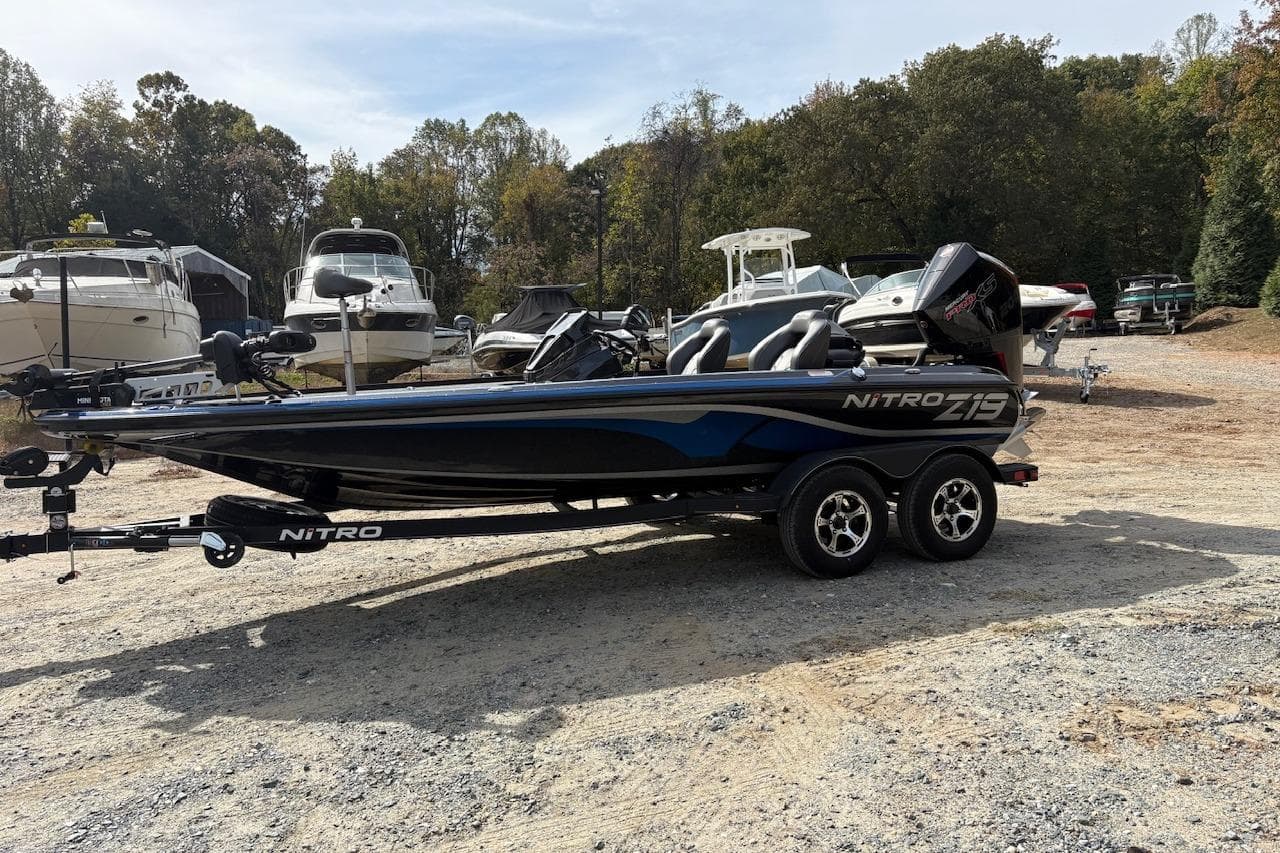 2024 Nitro Z19 boat on trailer in a marina setting.