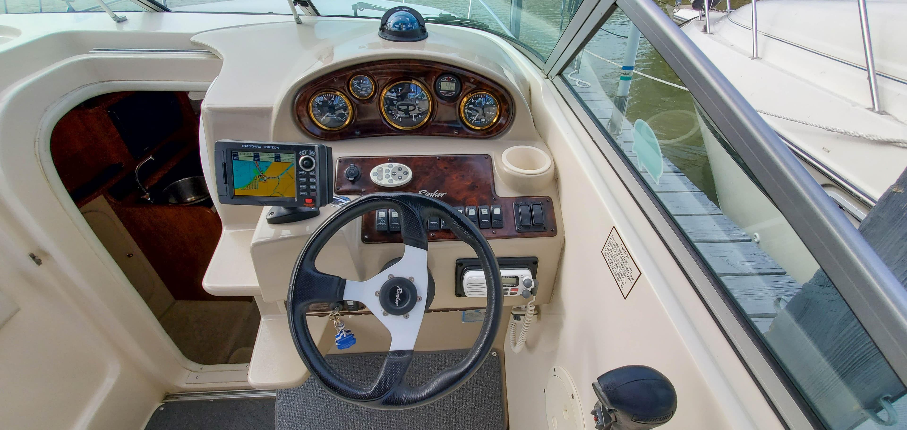 2003 Rinker Fiesta Vee 250 helm with navigation system.