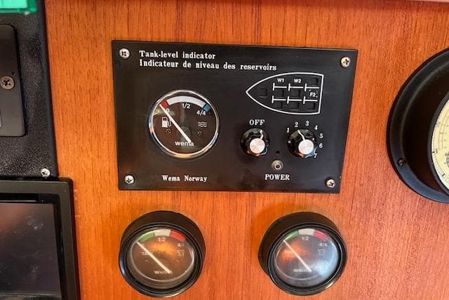 Tank-level indicator panel on a 1997 Hunter 430 boat dashboard.