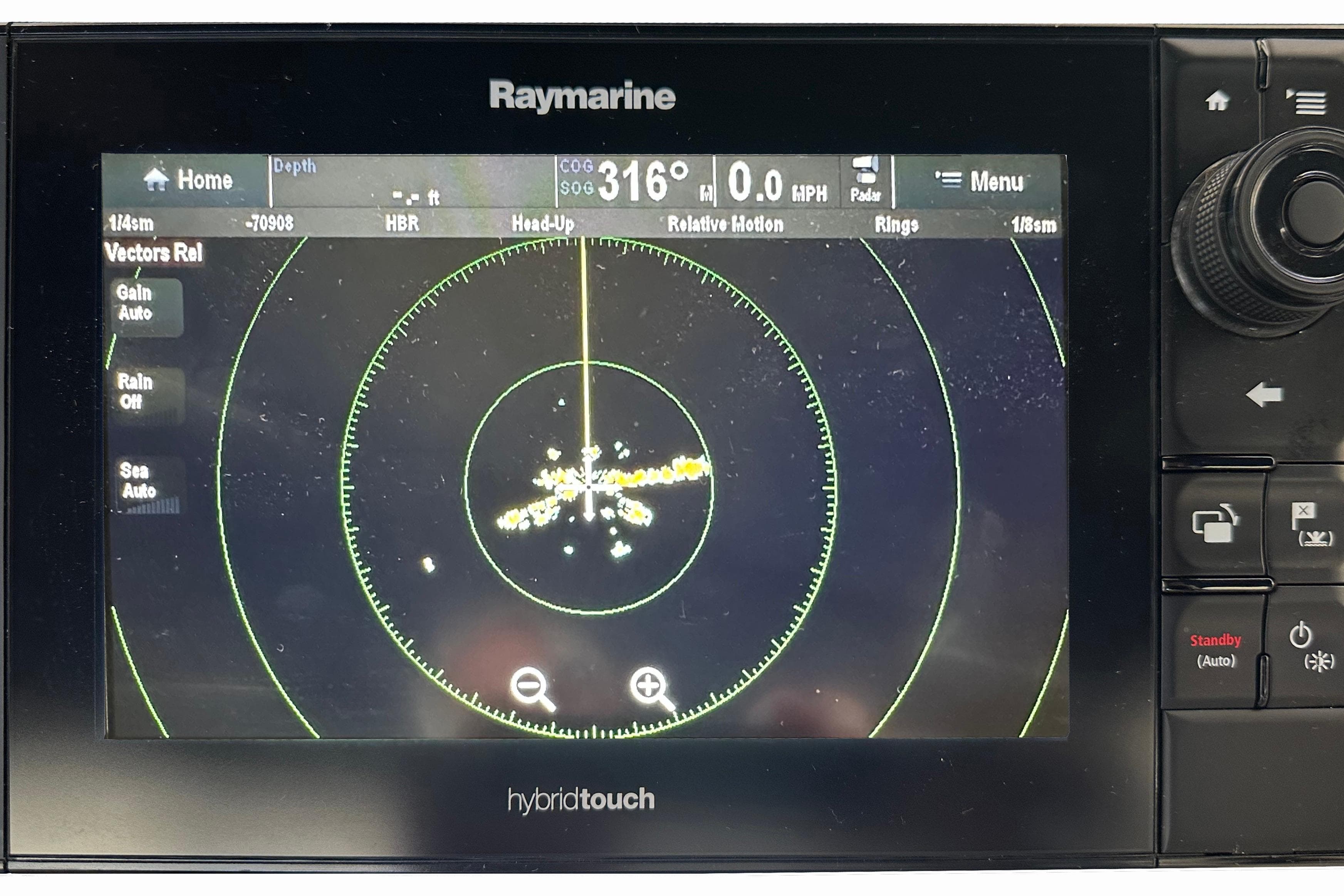 Raymarine HybridTouch radar display on 2004 Meridian 408 Motoryacht dashboard.