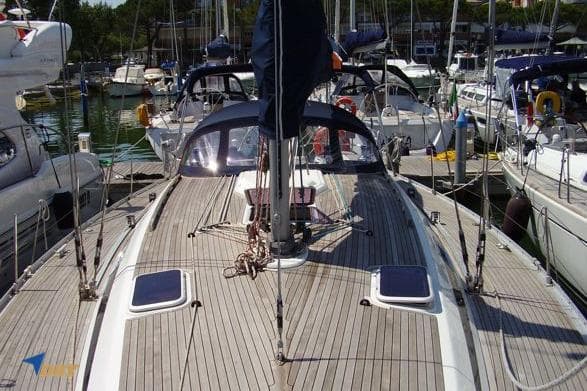2003 Grand Soleil 46.3 sailboat docked in a marina, showcasing its deck and rigging.