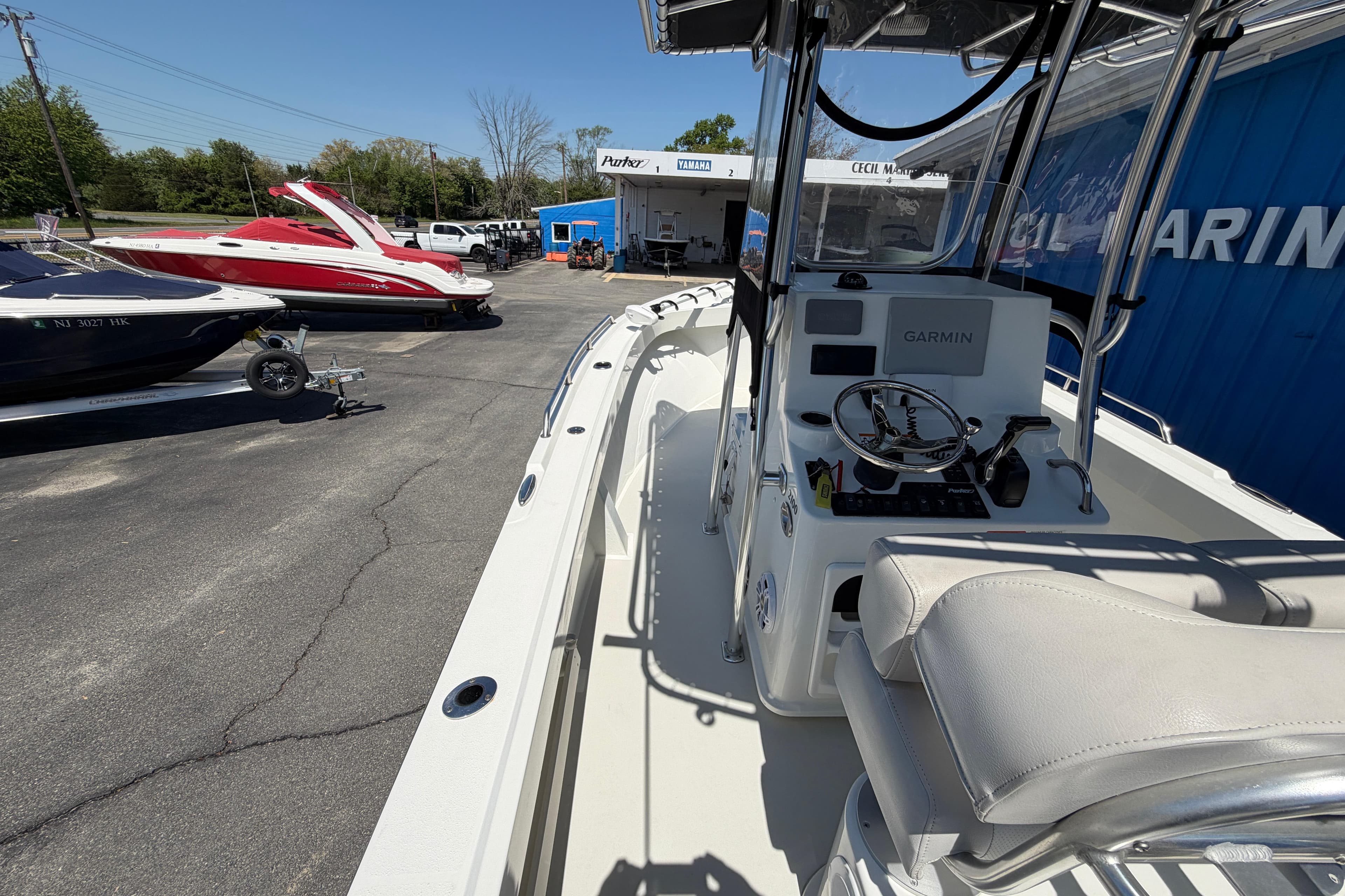 2016 Parker 2100 Center Console boat at a marina with other boats.