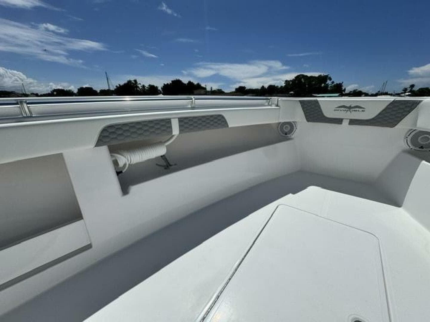 2025 Invincible 39 Open Fisherman boat interior under clear blue sky.