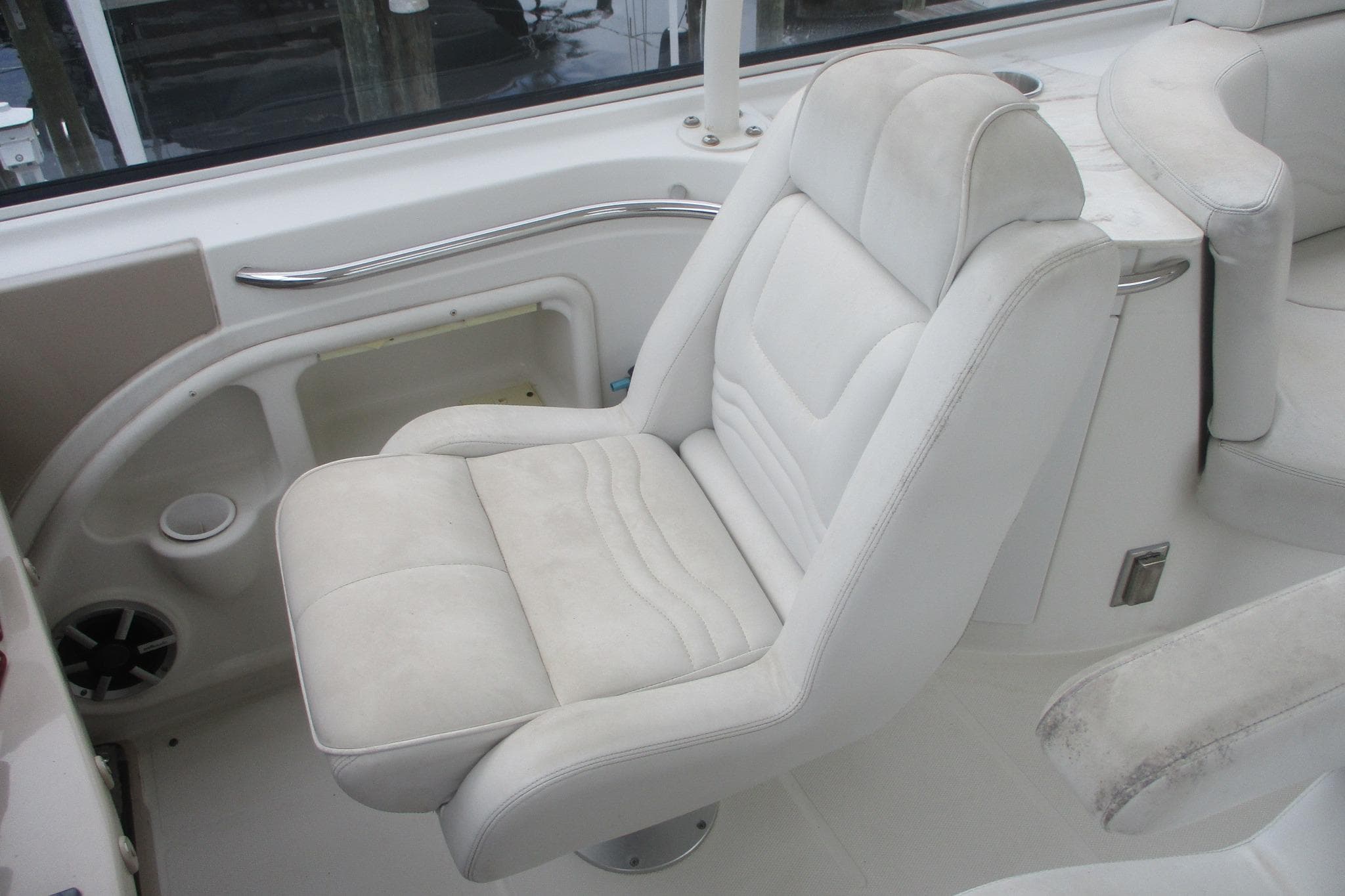 White captain's chair on 2006 Carver 466 Motor Yacht, featuring sleek design and comfortable seating.