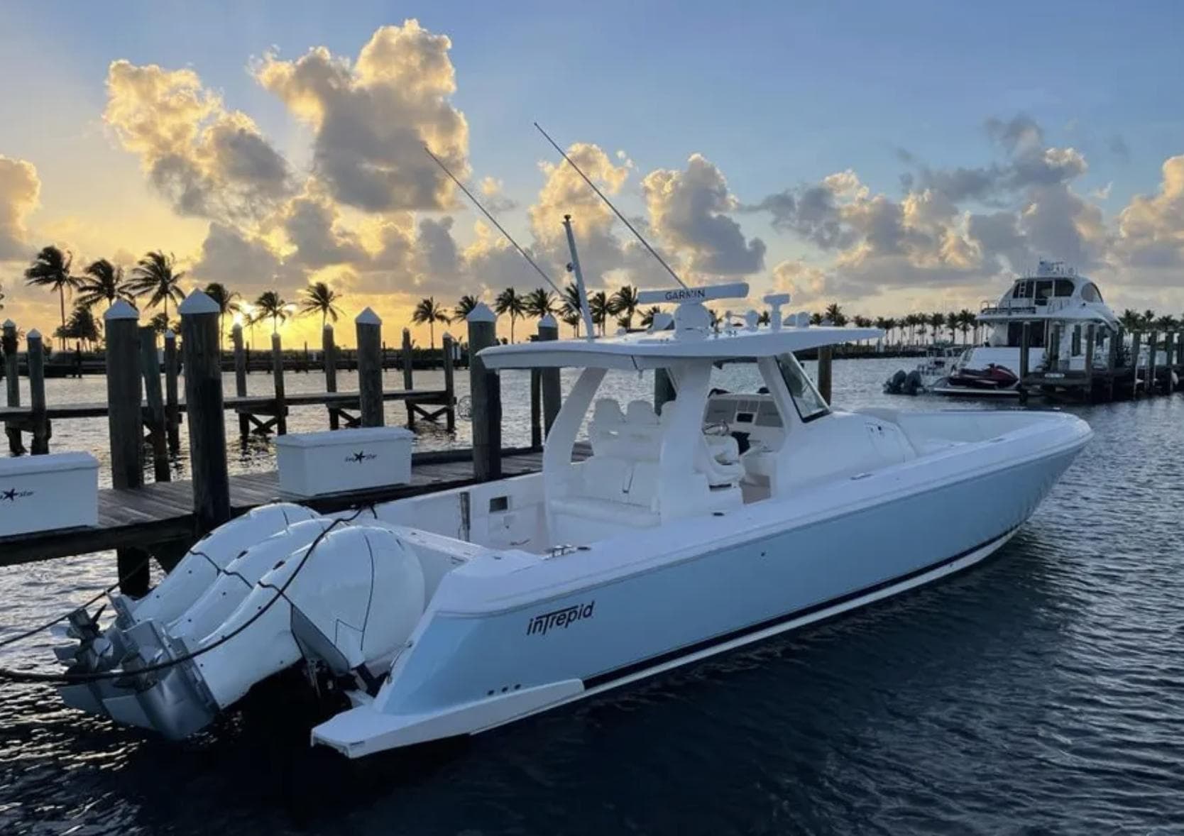 Intrepid 407 Nomad SE 2022 boat docked at sunset.