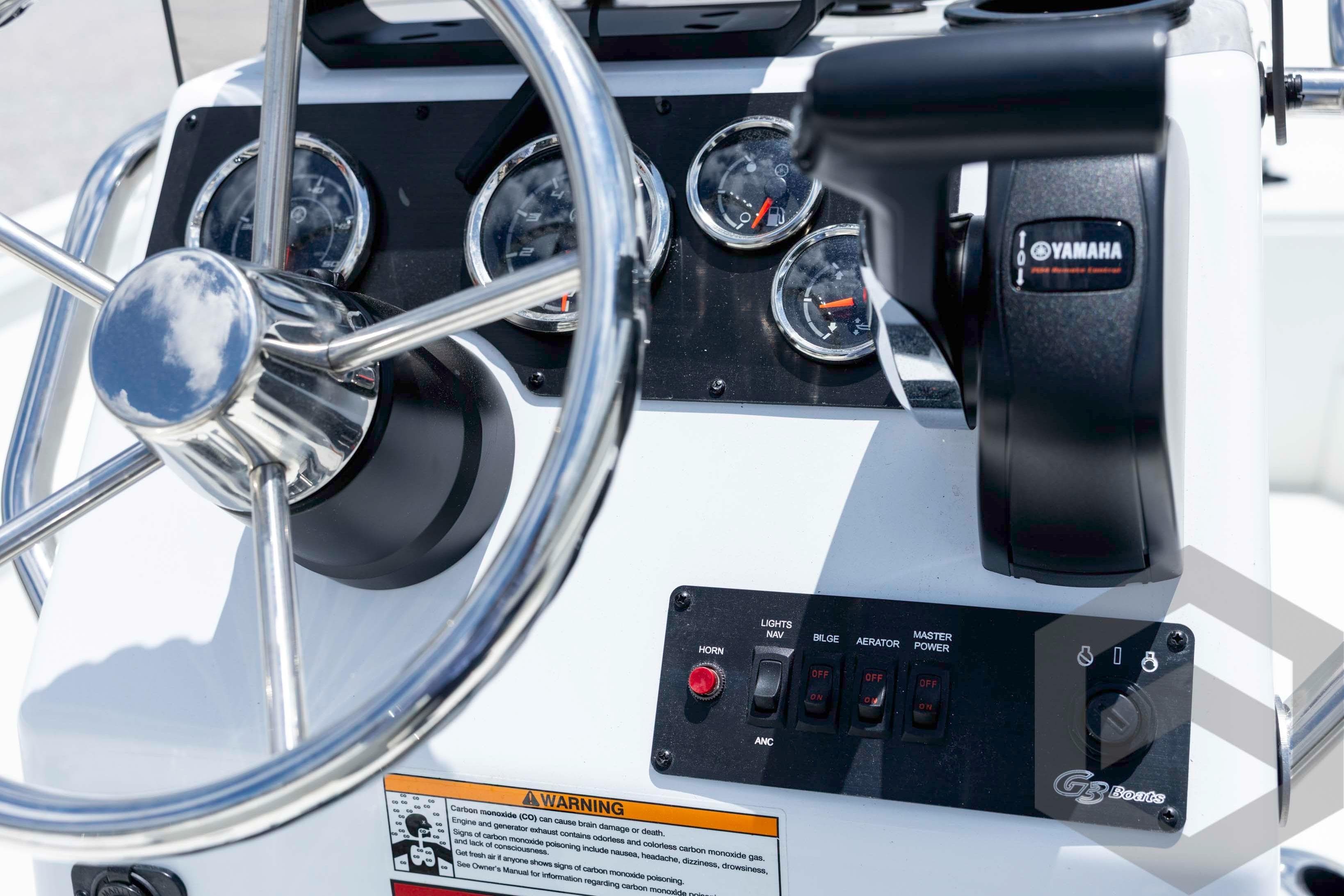 Steering console of 2026 G3 Bay 20 boat with Yamaha controls and gauges.