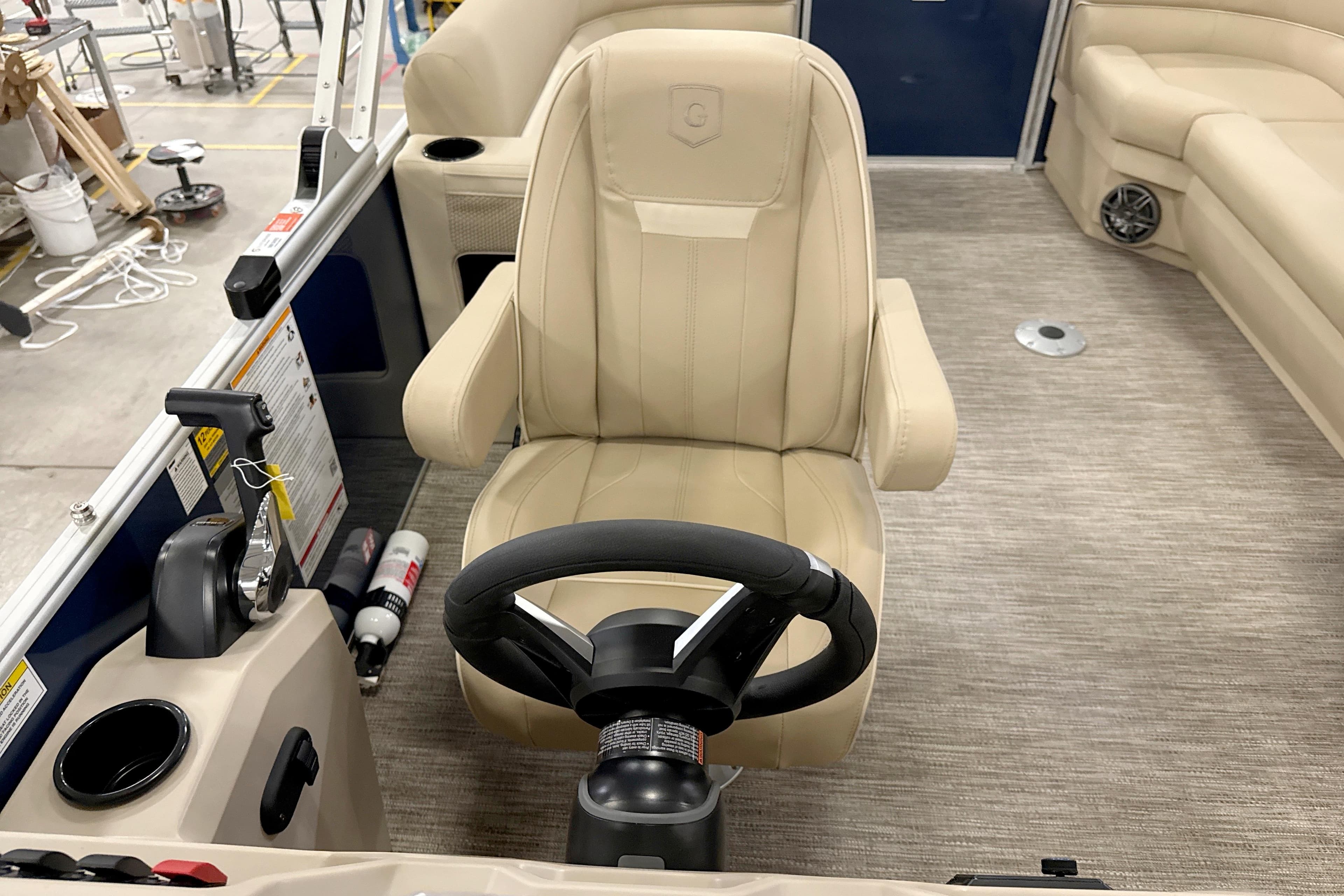 Captain's chair and helm of 2026 Godfrey Xperience 2286 SBX pontoon boat.