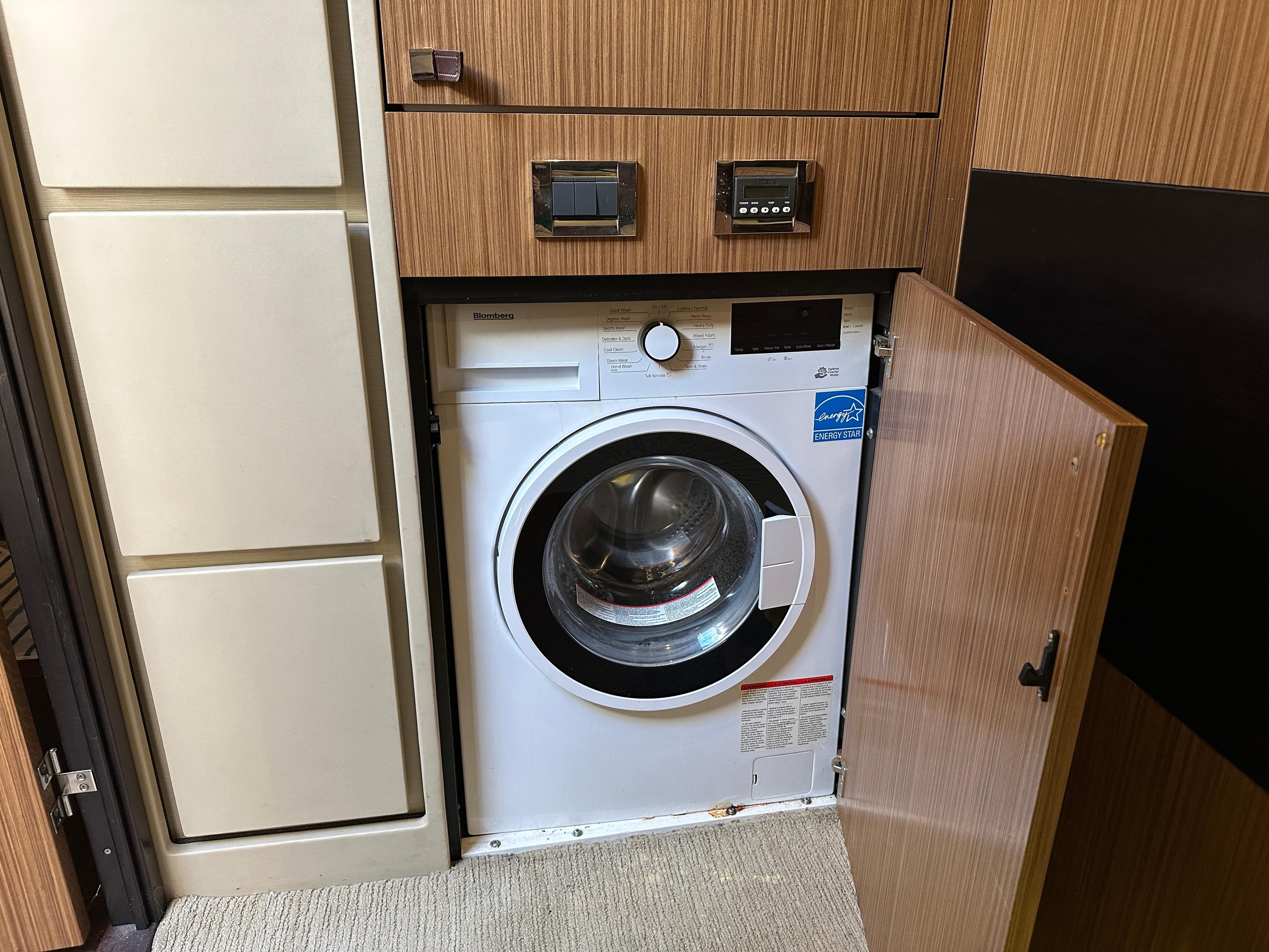 Built-in washing machine on 2016 Sea Ray L590 yacht, Energy Star certified.