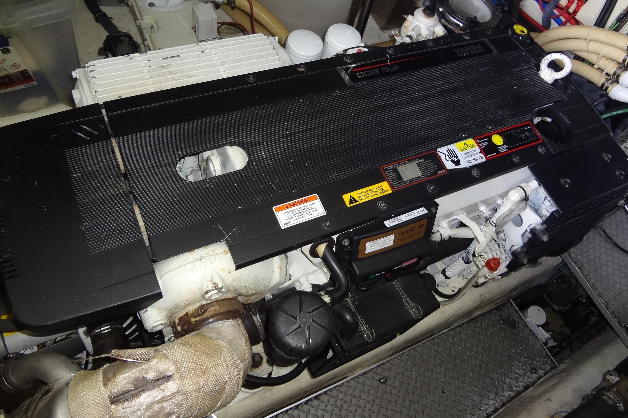 Engine compartment of a 2010 Formula 45 Yacht, featuring detailed mechanical components.