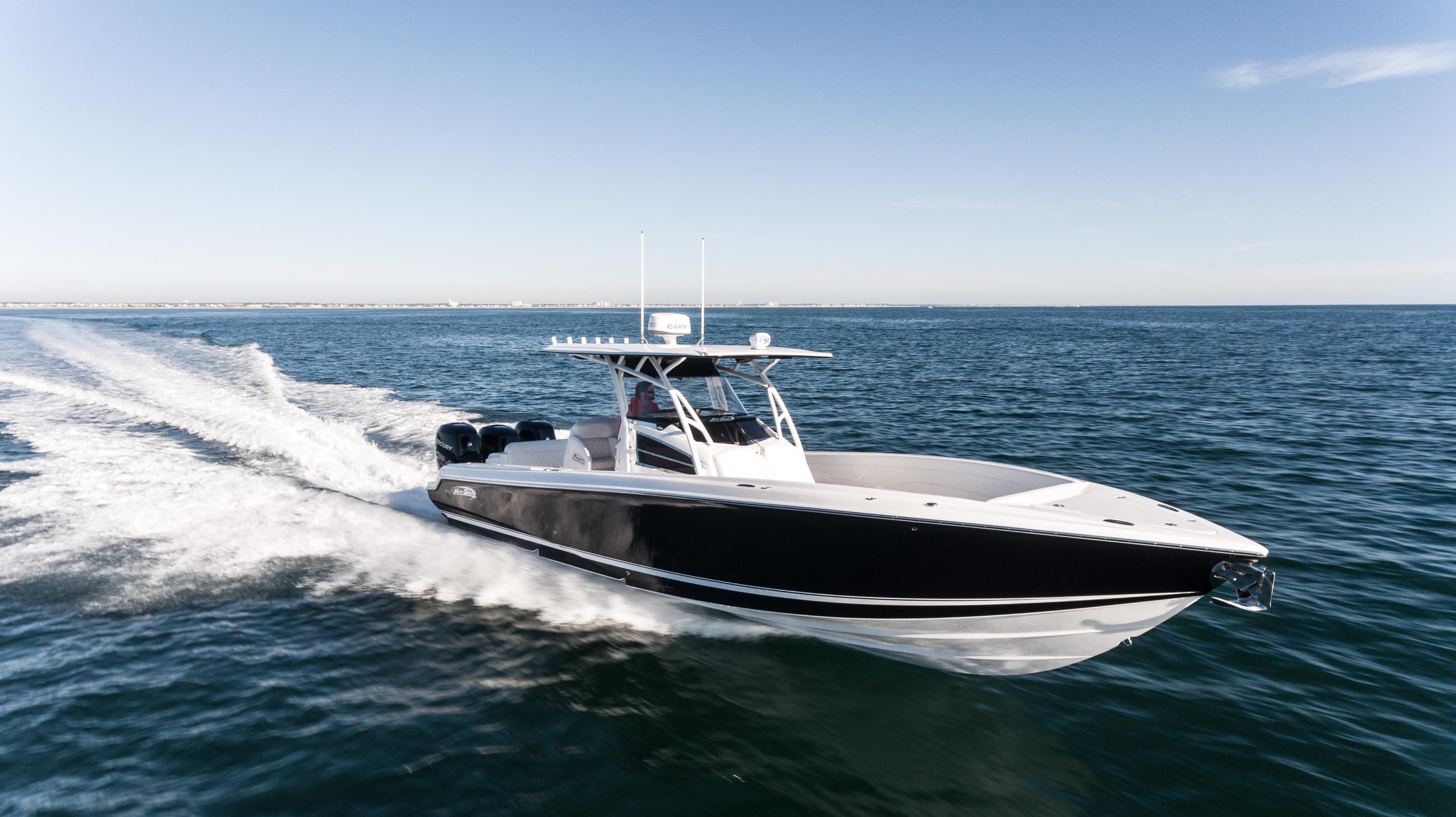 2025 Nor-Tech 340 boat cruising on open water, showcasing sleek design and powerful performance.