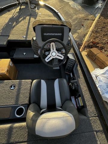 2024 Vexus AVX2080 boat interior with steering wheel and seat, featuring Humminbird electronics.