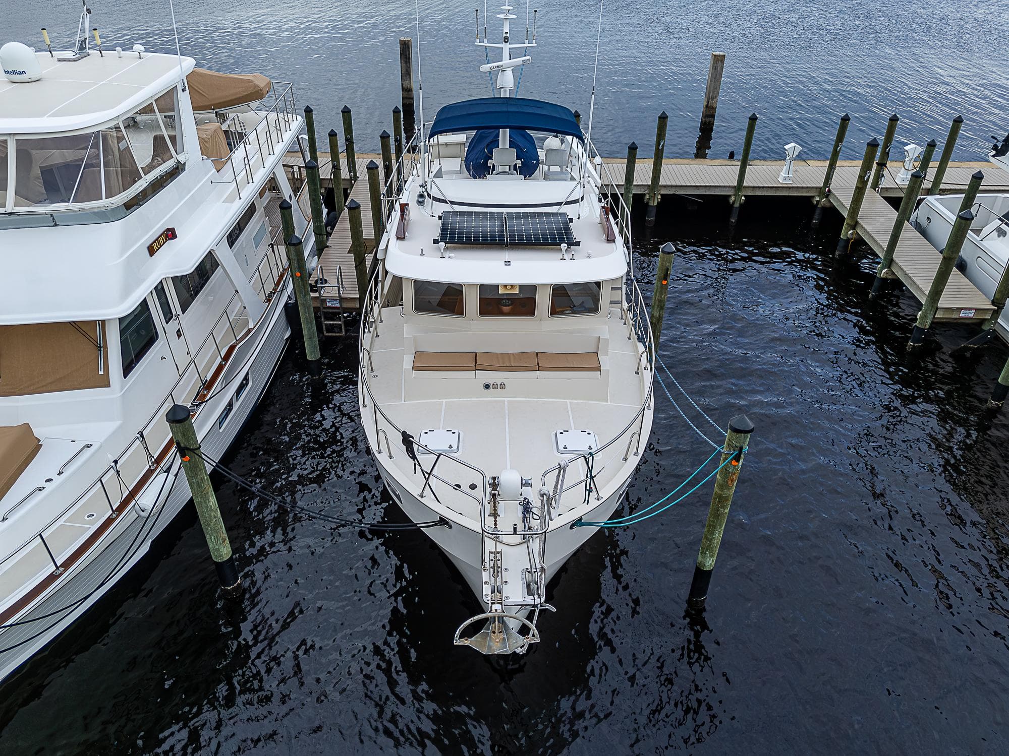 2004 Kadey-Krogen Krogen North Sea yacht docked at marina, aerial view.