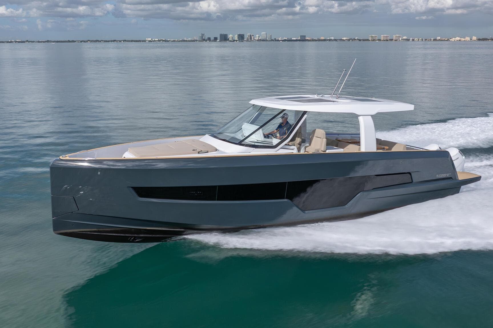 2026 Fjord 41 XP yacht cruising on calm waters under a cloudy sky.