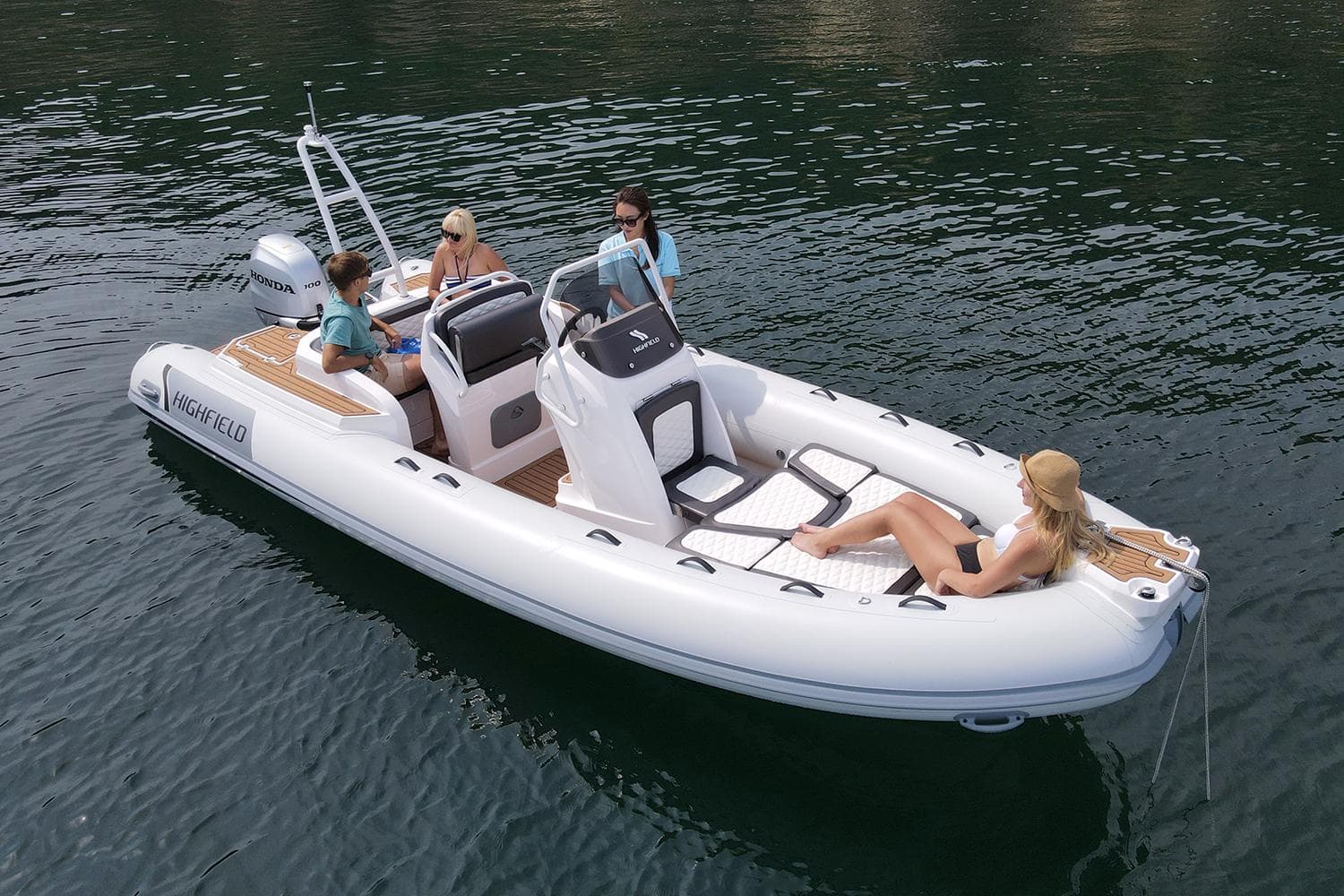 2025 Highfield Sport 650 boat with passengers on calm water.